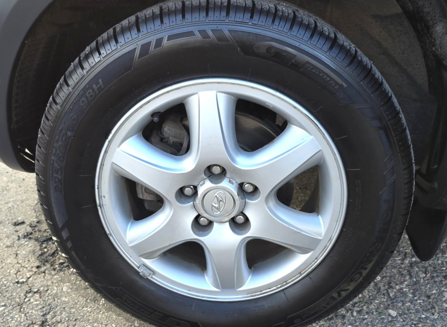 2005 Blue /White Hyundai Tucson GLS 2.7 4WD (KM8JN72D65U) with an 2.6L V6 DOHC 24V engine, 4-Speed Automatic Overdrive transmission, located at 450 N Russell, Missoula, MT, 59801, (406) 543-6600, 46.874496, -114.017433 - Hard to come across Affordable 2 Owner AWD SUV. Spunky 2.7L V6 Engine. Automatic Transmission. Power Sunroof. Power Windows and Locks. Heated Seats. Air. Cruise. Tilt. AM FM Cassette. Excellent Tires. Passenger Front Seat is a little worn so it has a seat cover on it. Because of the age, financi - Photo#21