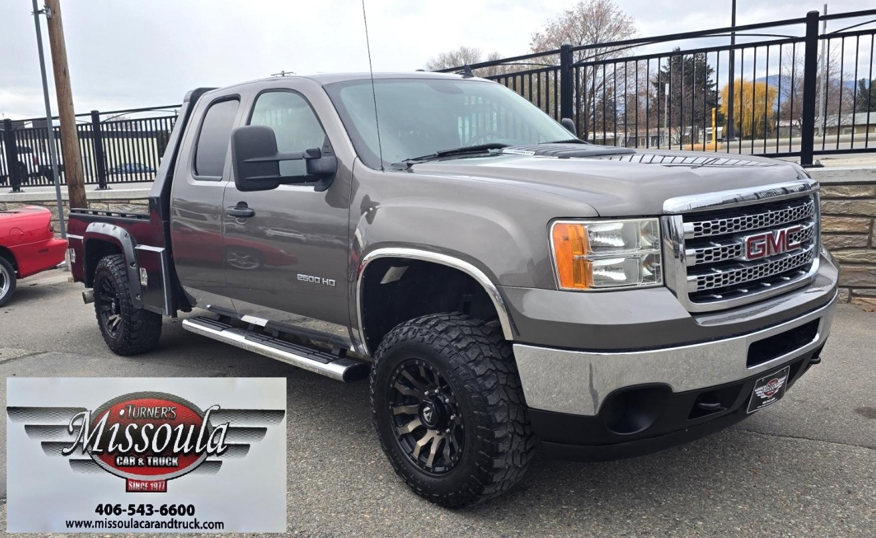 2013 Brown /Black GMC Sierra 2500HD SLE Ext. Cab 4WD (1GT220C86DZ) with an 6.6L V8 OHV 32V TURBO DIESEL engine, 6-Speed Automatic transmission, located at 450 N Russell, Missoula, MT, 59801, (406) 543-6600, 46.874496, -114.017433 - Rugged 4WD Chevy with a New Duramax Diesel Engine with only 25,000 miles on it. Tons of Upgrades and work done with receipts. Allison Automatic Transmission. Nice Flatbed. Power Windows and Locks. Air. Cruise. Tilt. AM FM CD Player. Running Boards. Nice Tires and Wheels. We Finance through local - Photo#1