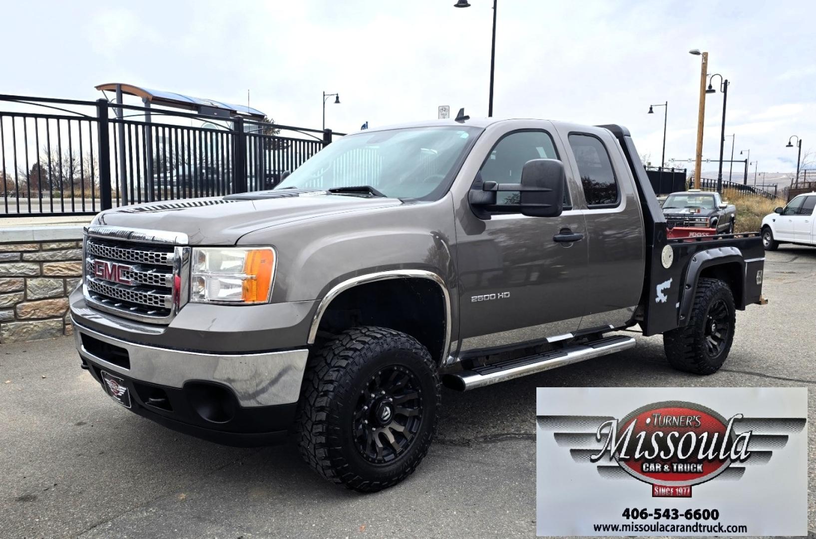 2013 Brown /Black GMC Sierra 2500HD SLE Ext. Cab 4WD (1GT220C86DZ) with an 6.6L V8 OHV 32V TURBO DIESEL engine, 6-Speed Automatic transmission, located at 450 N Russell, Missoula, MT, 59801, (406) 543-6600, 46.874496, -114.017433 - Rugged 4WD Chevy with a New Duramax Diesel Engine with only 25,000 miles on it. Tons of Upgrades and work done with receipts. Allison Automatic Transmission. Nice Flatbed. Power Windows and Locks. Air. Cruise. Tilt. AM FM CD Player. Running Boards. Nice Tires and Wheels. We Finance through local - Photo#3