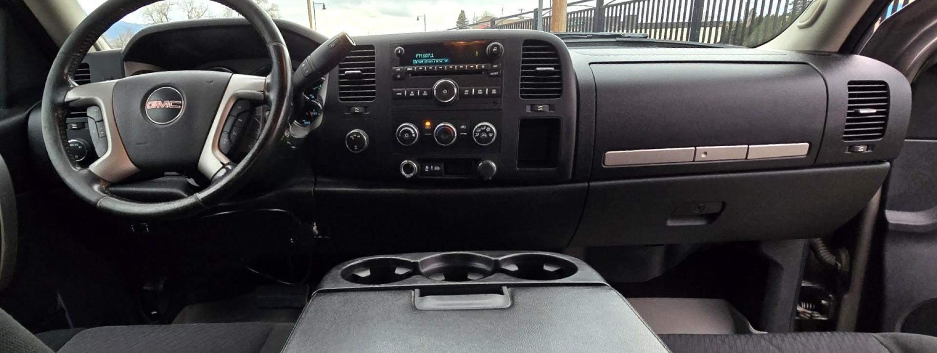 2013 Brown /Black GMC Sierra 2500HD SLE Ext. Cab 4WD (1GT220C86DZ) with an 6.6L V8 OHV 32V TURBO DIESEL engine, 6-Speed Automatic transmission, located at 450 N Russell, Missoula, MT, 59801, (406) 543-6600, 46.874496, -114.017433 - Rugged 4WD Chevy with a New Duramax Diesel Engine with only 25,000 miles on it. Tons of Upgrades and work done with receipts. Allison Automatic Transmission. Nice Flatbed. Power Windows and Locks. Air. Cruise. Tilt. AM FM CD Player. Running Boards. Nice Tires and Wheels. We Finance through local - Photo#6