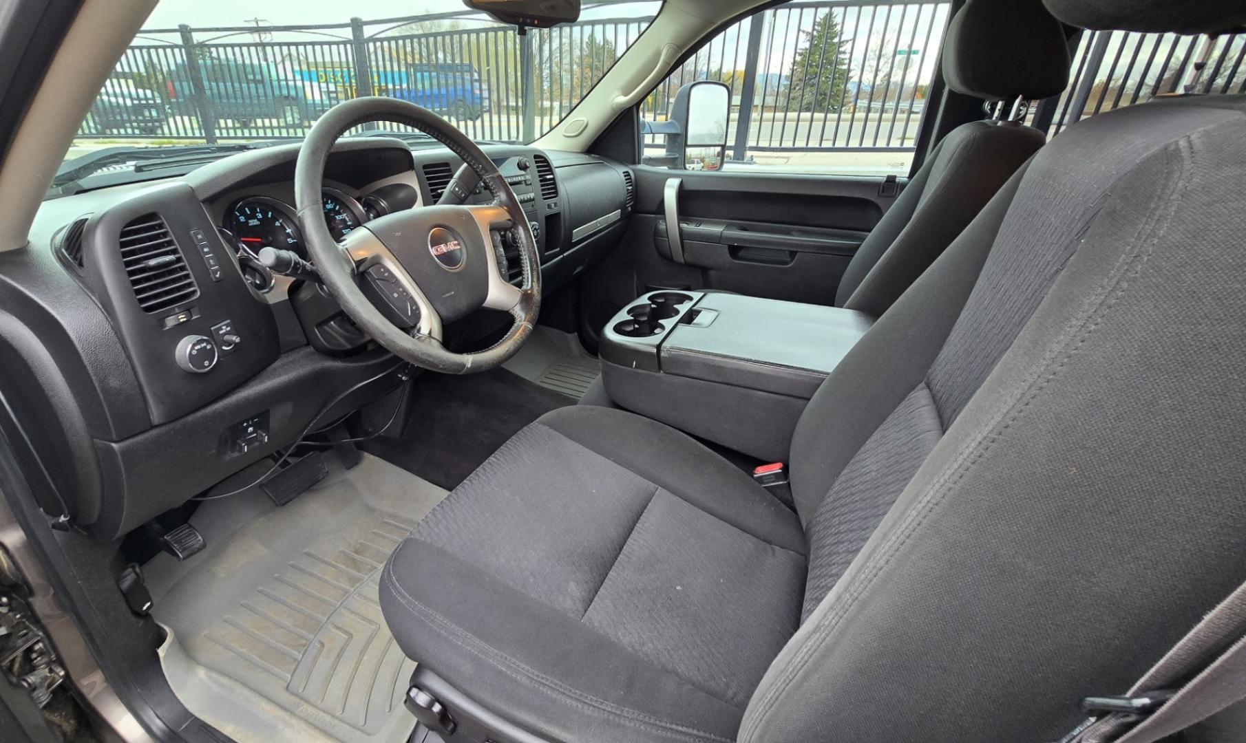 2013 Brown /Black GMC Sierra 2500HD SLE Ext. Cab 4WD (1GT220C86DZ) with an 6.6L V8 OHV 32V TURBO DIESEL engine, 6-Speed Automatic transmission, located at 450 N Russell, Missoula, MT, 59801, (406) 543-6600, 46.874496, -114.017433 - Rugged 4WD Chevy with a New Duramax Diesel Engine with only 25,000 miles on it. Tons of Upgrades and work done with receipts. Allison Automatic Transmission. Nice Flatbed. Power Windows and Locks. Air. Cruise. Tilt. AM FM CD Player. Running Boards. Nice Tires and Wheels. We Finance through local - Photo#8