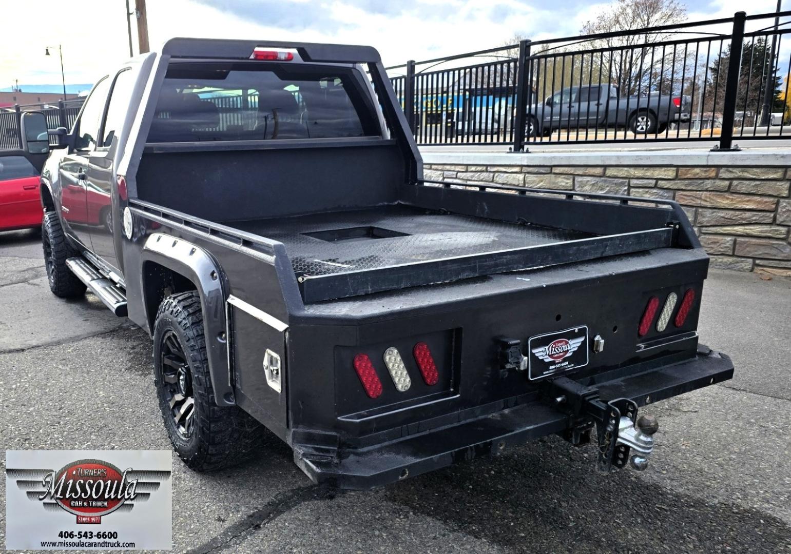 2013 Brown /Black GMC Sierra 2500HD SLE Ext. Cab 4WD (1GT220C86DZ) with an 6.6L V8 OHV 32V TURBO DIESEL engine, 6-Speed Automatic transmission, located at 450 N Russell, Missoula, MT, 59801, (406) 543-6600, 46.874496, -114.017433 - Rugged 4WD Chevy with a New Duramax Diesel Engine with only 25,000 miles on it. Tons of Upgrades and work done with receipts. Allison Automatic Transmission. Nice Flatbed. Power Windows and Locks. Air. Cruise. Tilt. AM FM CD Player. Running Boards. Nice Tires and Wheels. We Finance through local - Photo#13