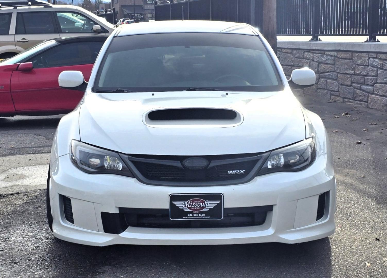 2012 White /Black Subaru Impreza WRX WRX Turbo (JF1GR7E65CG) with an 2.5L H4 DOHC 16V TURBO engine, 5-Speed Manual transmission, located at 450 N Russell, Missoula, MT, 59801, (406) 543-6600, 46.874496, -114.017433 - Zippy Little Subaru AWD with only 86K Miles. 2.5L H4 Turbo Engine. 5 Speed Manual Transmission. WRX Package with Nice Bucket Seats. Air. Cruise. Tilt. Power Windows and Locks. AM FM SAT CD Player. Bluetooth Phone Connection. Nice Wheels with Brand New Tires. Cat back exhaust adjustable coil overs - Photo#1