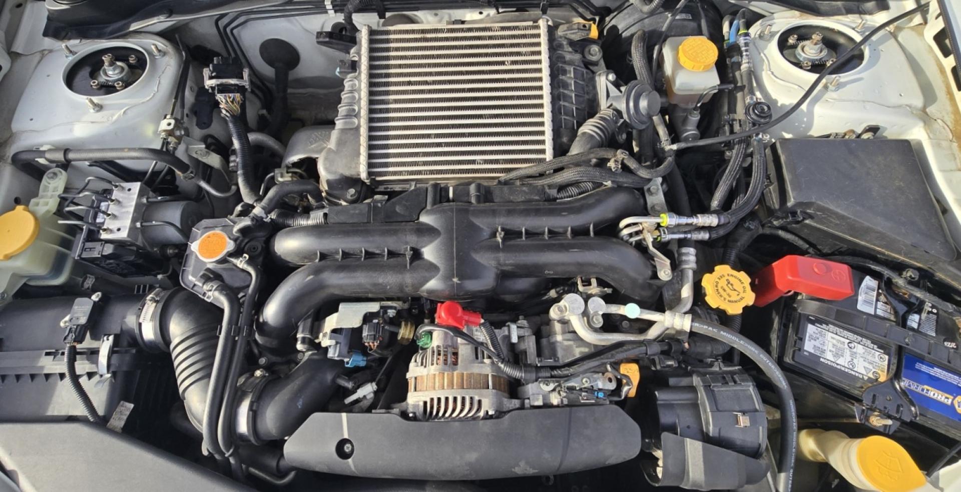 2012 White /Black Subaru Impreza WRX WRX Turbo (JF1GR7E65CG) with an 2.5L H4 DOHC 16V TURBO engine, 5-Speed Manual transmission, located at 450 N Russell, Missoula, MT, 59801, (406) 543-6600, 46.874496, -114.017433 - Zippy Little Subaru AWD with only 86K Miles. 2.5L H4 Turbo Engine. 5 Speed Manual Transmission. WRX Package with Nice Bucket Seats. Air. Cruise. Tilt. Power Windows and Locks. AM FM SAT CD Player. Bluetooth Phone Connection. Nice Wheels with Brand New Tires. Cat back exhaust adjustable coil overs - Photo#17