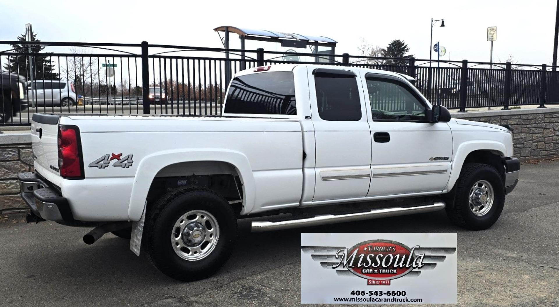 2004 White /Black Chevrolet Silverado 2500HD Ext. Cab Long Bed 4WD (1GCHK29G54E) with an 8.1L V8 OHV 16V engine, Automatic Transmission transmission, located at 450 N Russell, Missoula, MT, 59801, (406) 543-6600, 46.874496, -114.017433 - Near Impossible to find. Heavy Duty 3/4 Ton Chevy 4WD with the Impressive 8.1 Liter Vortec Engine. To top that, it only has 64K Miles! Excellent Condition. Automatic Transmission. Air. Cruise. Tilt. Power Windows and Locks. Power Drivers Seat. AM FM CD and Cassette Player for kicking it Old School. - Photo#1