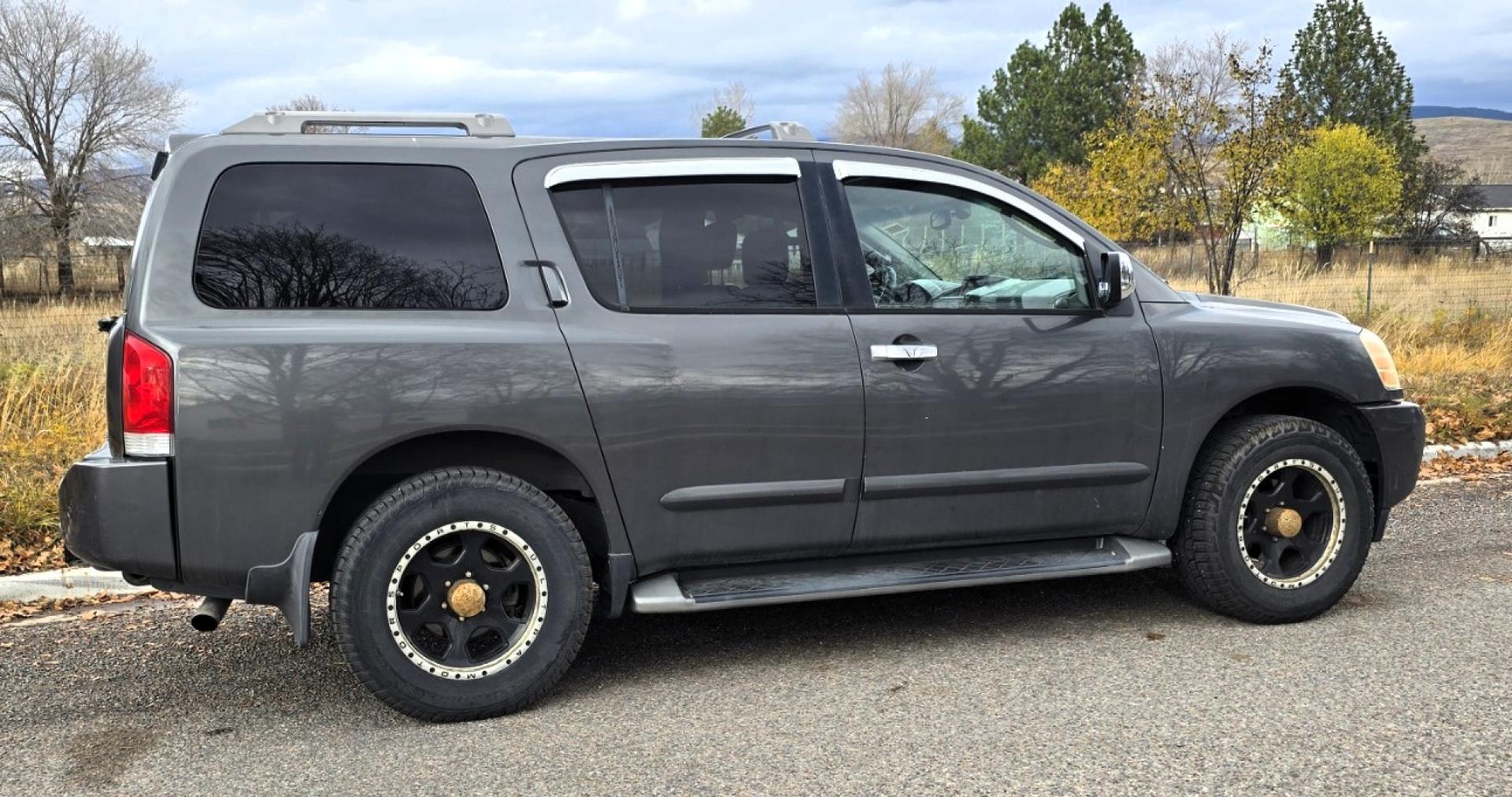 2004 Grey /Gray Nissan Armada LE 4WD (5N1AA08BX4N) with an 5.6L V8 DOHC 32V engine, 5-Speed Automatic Overdrive transmission, located at 450 N Russell, Missoula, MT, 59801, (406) 543-6600, 46.874496, -114.017433 - One Owner 4WD SUV. 5.6L V8 Engine. Loaded with features. CD Changer. Rear Entertainment. 3rd Row Seats, Heated Front Seats. Navigation. Power Sunroof. Running Boards. Dual Climate Control. Two Sets of tires and wheels. One of the sets is really only good for the wheels. The set on the vehicle is exc - Photo#0