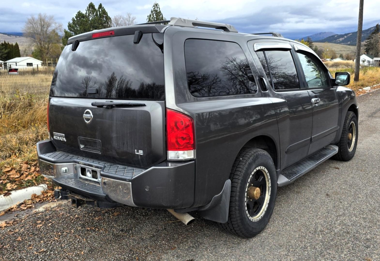2004 Grey /Gray Nissan Armada LE 4WD (5N1AA08BX4N) with an 5.6L V8 DOHC 32V engine, 5-Speed Automatic Overdrive transmission, located at 450 N Russell, Missoula, MT, 59801, (406) 543-6600, 46.874496, -114.017433 - One Owner 4WD SUV. 5.6L V8 Engine. Loaded with features. CD Changer. Rear Entertainment. 3rd Row Seats, Heated Front Seats. Navigation. Power Sunroof. Running Boards. Dual Climate Control. Two Sets of tires and wheels. One of the sets is really only good for the wheels. The set on the vehicle is exc - Photo#1