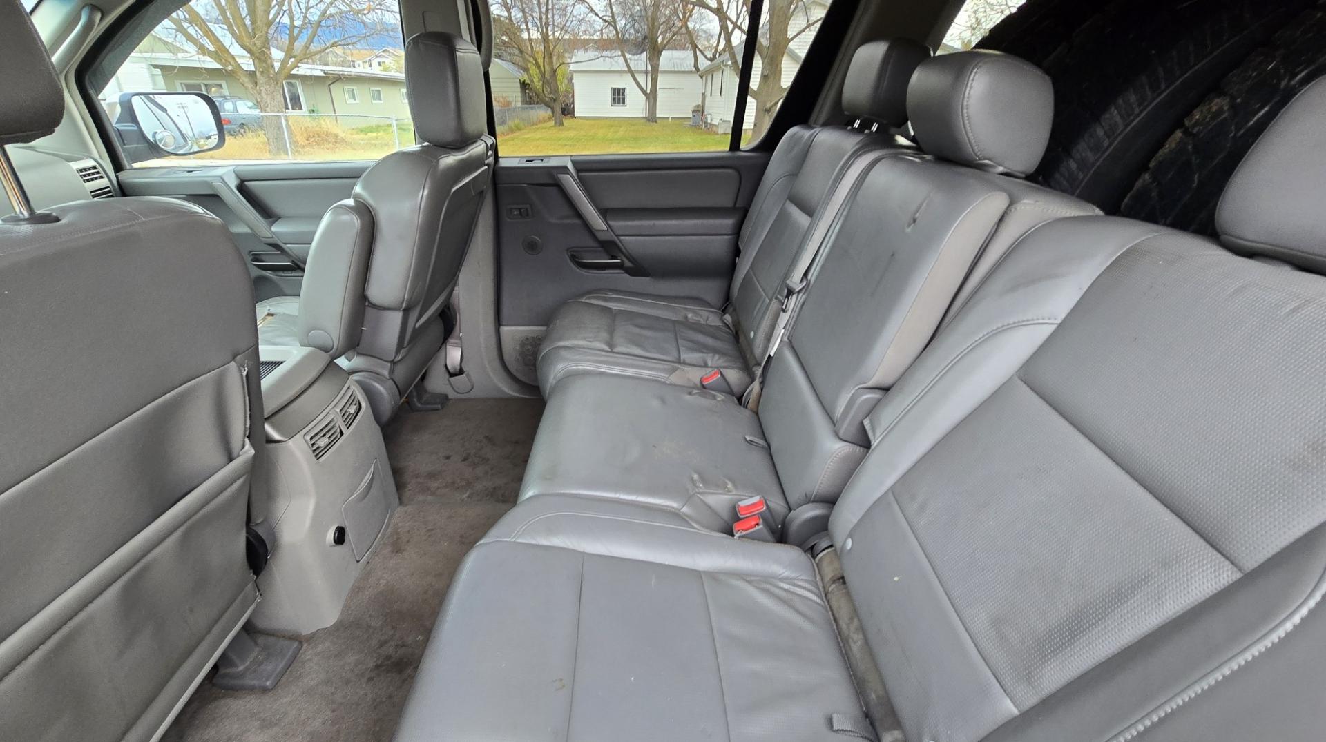 2004 Grey /Gray Nissan Armada LE 4WD (5N1AA08BX4N) with an 5.6L V8 DOHC 32V engine, 5-Speed Automatic Overdrive transmission, located at 450 N Russell, Missoula, MT, 59801, (406) 543-6600, 46.874496, -114.017433 - One Owner 4WD SUV. 5.6L V8 Engine. Loaded with features. CD Changer. Rear Entertainment. 3rd Row Seats, Heated Front Seats. Navigation. Power Sunroof. Running Boards. Dual Climate Control. Two Sets of tires and wheels. One of the sets is really only good for the wheels. The set on the vehicle is exc - Photo#9