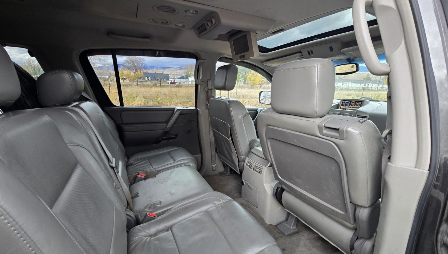 2004 Grey /Gray Nissan Armada LE 4WD (5N1AA08BX4N) with an 5.6L V8 DOHC 32V engine, 5-Speed Automatic Overdrive transmission, located at 450 N Russell, Missoula, MT, 59801, (406) 543-6600, 46.874496, -114.017433 - One Owner 4WD SUV. 5.6L V8 Engine. Loaded with features. CD Changer. Rear Entertainment. 3rd Row Seats, Heated Front Seats. Navigation. Power Sunroof. Running Boards. Dual Climate Control. Two Sets of tires and wheels. One of the sets is really only good for the wheels. The set on the vehicle is exc - Photo#8