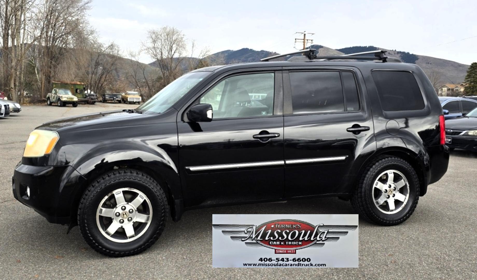 2009 Black /Black Honda Pilot Touring 4WD with RES & Navigation (5FNYF48919B) with an 3.5L V6 SOHC 24V engine, 5-Speed Automatic Overdrive transmission, located at 450 N Russell, Missoula, MT, 59801, (406) 543-6600, 46.874496, -114.017433 - Yes it's a lot of miles but the motor has been well maintained. New Timing Belt only has 18K Miles on it. Runs Amazing. 3.5L V6 has lots of pep. 4WD Works Great., Nice All terrain tires are like new, Heated Power Leather Front Seats. 3rd Row Seating in the back. Power Sun Roof. Power Windows and Loc - Photo#2