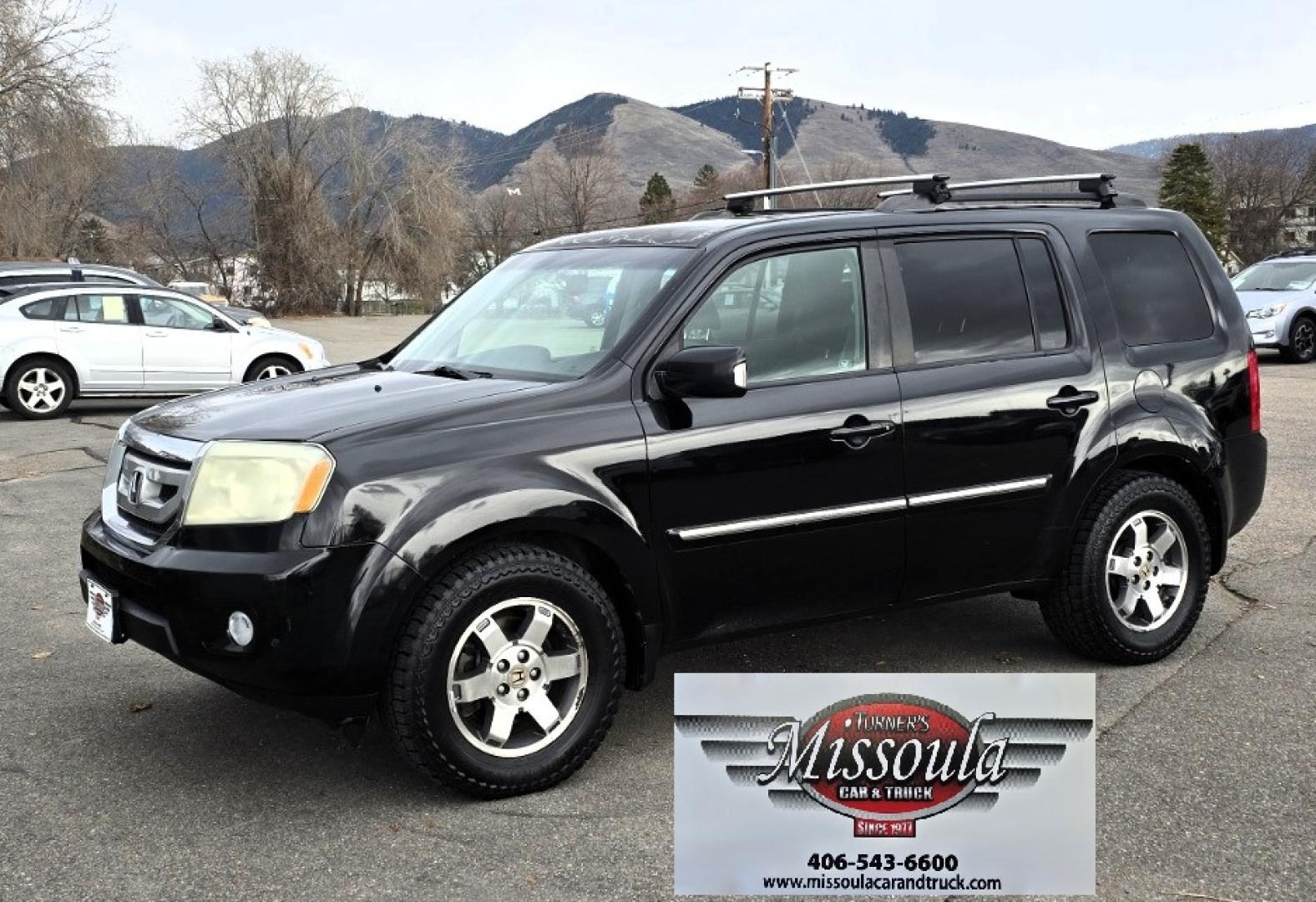 2009 Black /Black Honda Pilot Touring 4WD with RES & Navigation (5FNYF48919B) with an 3.5L V6 SOHC 24V engine, 5-Speed Automatic Overdrive transmission, located at 450 N Russell, Missoula, MT, 59801, (406) 543-6600, 46.874496, -114.017433 - Yes it's a lot of miles but the motor has been well maintained. New Timing Belt only has 18K Miles on it. Runs Amazing. 3.5L V6 has lots of pep. 4WD Works Great., Nice All terrain tires are like new, Heated Power Leather Front Seats. 3rd Row Seating in the back. Power Sun Roof. Power Windows and Loc - Photo#0
