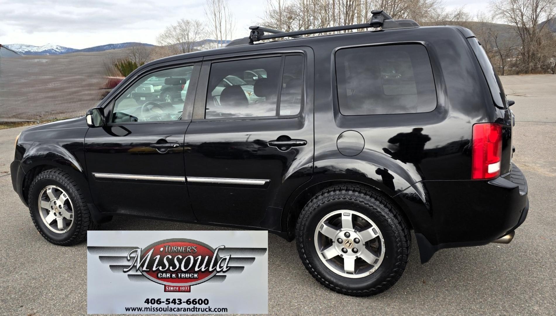 2009 Black /Black Honda Pilot Touring 4WD with RES & Navigation (5FNYF48919B) with an 3.5L V6 SOHC 24V engine, 5-Speed Automatic Overdrive transmission, located at 450 N Russell, Missoula, MT, 59801, (406) 543-6600, 46.874496, -114.017433 - Yes it's a lot of miles but the motor has been well maintained. New Timing Belt only has 18K Miles on it. Runs Amazing. 3.5L V6 has lots of pep. 4WD Works Great., Nice All terrain tires are like new, Heated Power Leather Front Seats. 3rd Row Seating in the back. Power Sun Roof. Power Windows and Loc - Photo#3