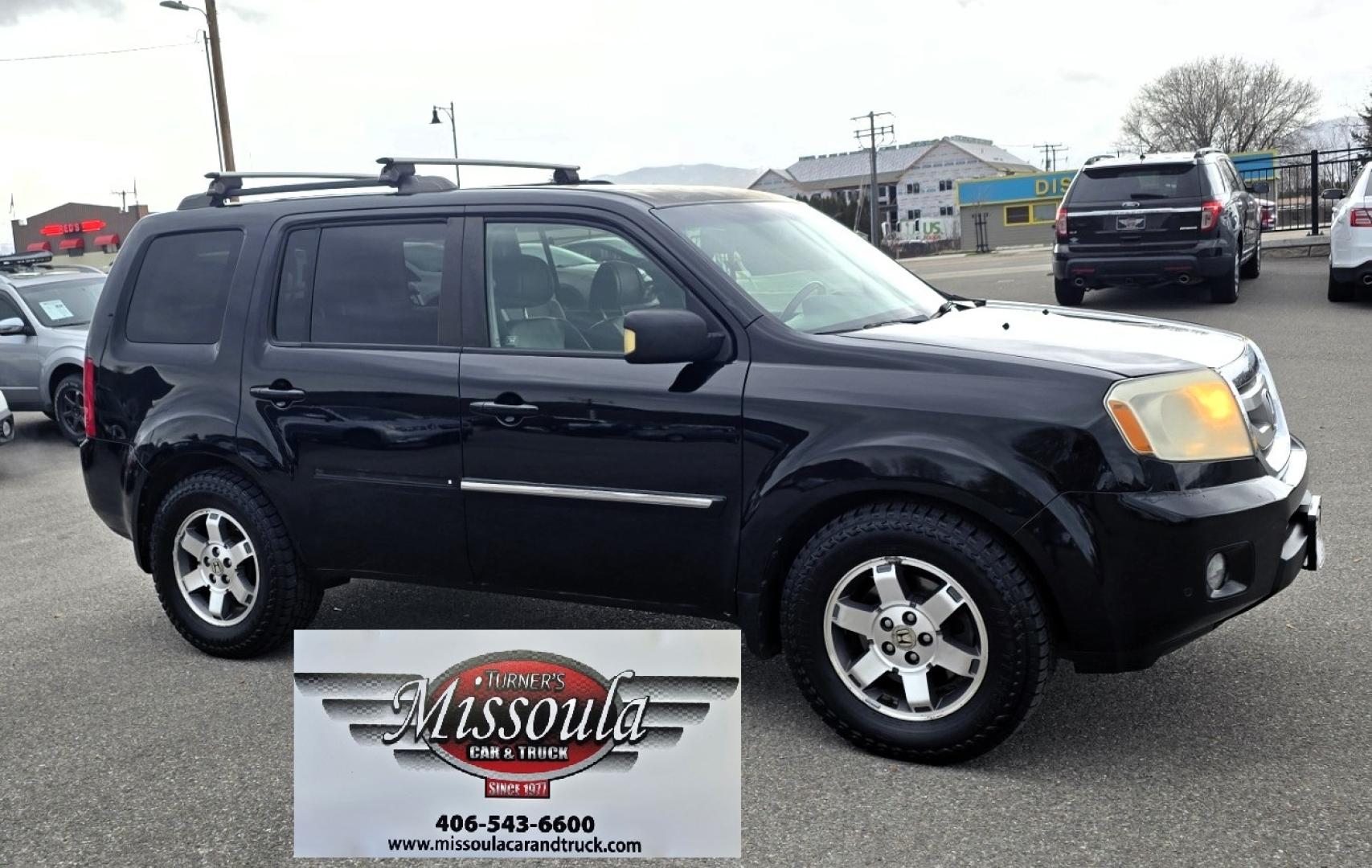 2009 Black /Black Honda Pilot Touring 4WD with RES & Navigation (5FNYF48919B) with an 3.5L V6 SOHC 24V engine, 5-Speed Automatic Overdrive transmission, located at 450 N Russell, Missoula, MT, 59801, (406) 543-6600, 46.874496, -114.017433 - Yes it's a lot of miles but the motor has been well maintained. New Timing Belt only has 18K Miles on it. Runs Amazing. 3.5L V6 has lots of pep. 4WD Works Great., Nice All terrain tires are like new, Heated Power Leather Front Seats. 3rd Row Seating in the back. Power Sun Roof. Power Windows and Loc - Photo#8