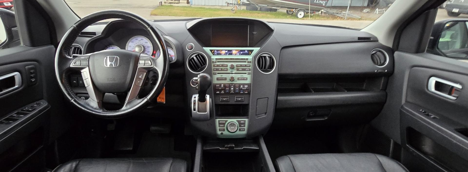 2009 Black /Black Honda Pilot Touring 4WD with RES & Navigation (5FNYF48919B) with an 3.5L V6 SOHC 24V engine, 5-Speed Automatic Overdrive transmission, located at 450 N Russell, Missoula, MT, 59801, (406) 543-6600, 46.874496, -114.017433 - Yes it's a lot of miles but the motor has been well maintained. New Timing Belt only has 18K Miles on it. Runs Amazing. 3.5L V6 has lots of pep. 4WD Works Great., Nice All terrain tires are like new, Heated Power Leather Front Seats. 3rd Row Seating in the back. Power Sun Roof. Power Windows and Loc - Photo#14