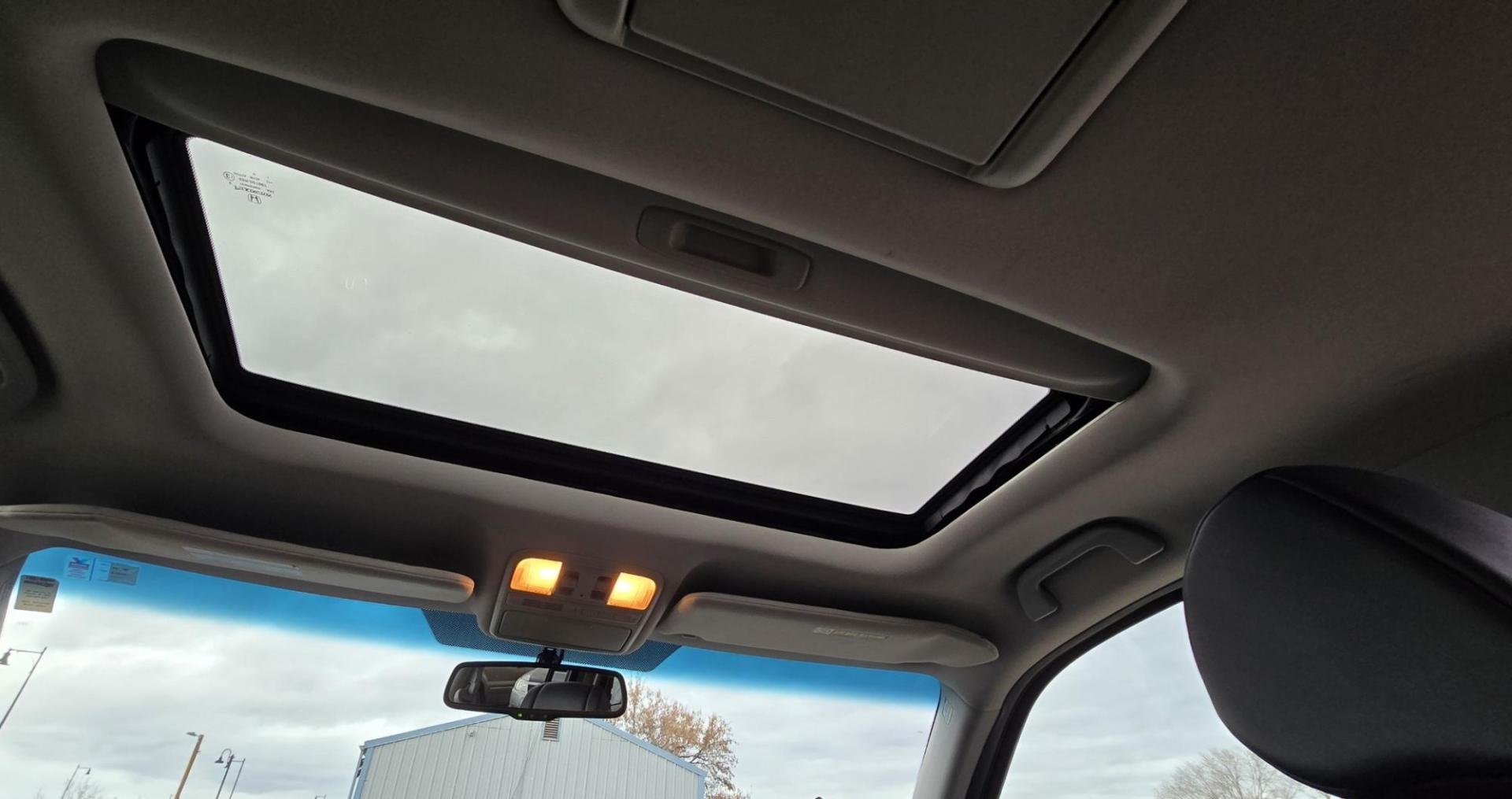 2009 Black /Black Honda Pilot Touring 4WD with RES & Navigation (5FNYF48919B) with an 3.5L V6 SOHC 24V engine, 5-Speed Automatic Overdrive transmission, located at 450 N Russell, Missoula, MT, 59801, (406) 543-6600, 46.874496, -114.017433 - Yes it's a lot of miles but the motor has been well maintained. New Timing Belt only has 18K Miles on it. Runs Amazing. 3.5L V6 has lots of pep. 4WD Works Great., Nice All terrain tires are like new, Heated Power Leather Front Seats. 3rd Row Seating in the back. Power Sun Roof. Power Windows and Loc - Photo#15