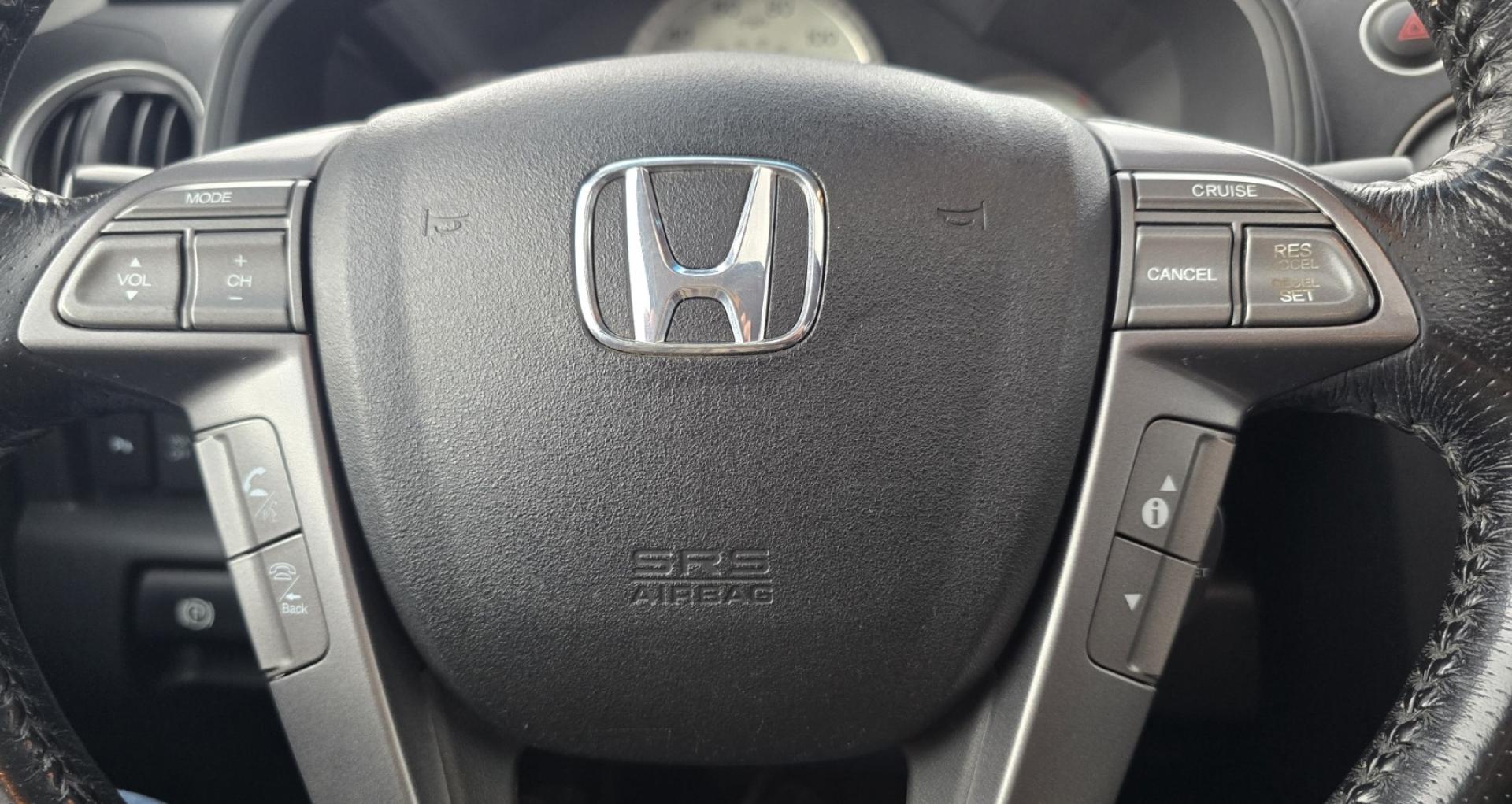 2009 Black /Black Honda Pilot Touring 4WD with RES & Navigation (5FNYF48919B) with an 3.5L V6 SOHC 24V engine, 5-Speed Automatic Overdrive transmission, located at 450 N Russell, Missoula, MT, 59801, (406) 543-6600, 46.874496, -114.017433 - Yes it's a lot of miles but the motor has been well maintained. New Timing Belt only has 18K Miles on it. Runs Amazing. 3.5L V6 has lots of pep. 4WD Works Great., Nice All terrain tires are like new, Heated Power Leather Front Seats. 3rd Row Seating in the back. Power Sun Roof. Power Windows and Loc - Photo#19