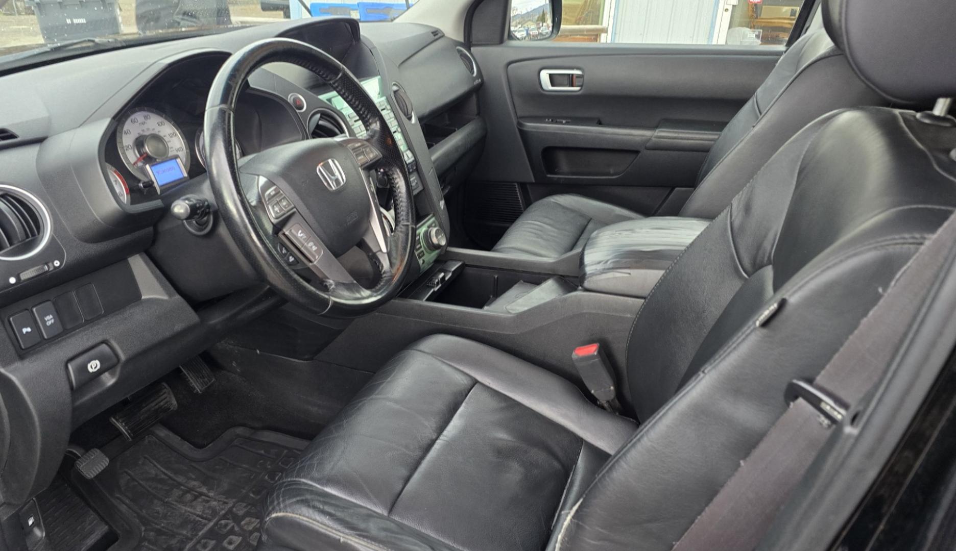 2009 Black /Black Honda Pilot Touring 4WD with RES & Navigation (5FNYF48919B) with an 3.5L V6 SOHC 24V engine, 5-Speed Automatic Overdrive transmission, located at 450 N Russell, Missoula, MT, 59801, (406) 543-6600, 46.874496, -114.017433 - Yes it's a lot of miles but the motor has been well maintained. New Timing Belt only has 18K Miles on it. Runs Amazing. 3.5L V6 has lots of pep. 4WD Works Great., Nice All terrain tires are like new, Heated Power Leather Front Seats. 3rd Row Seating in the back. Power Sun Roof. Power Windows and Loc - Photo#21