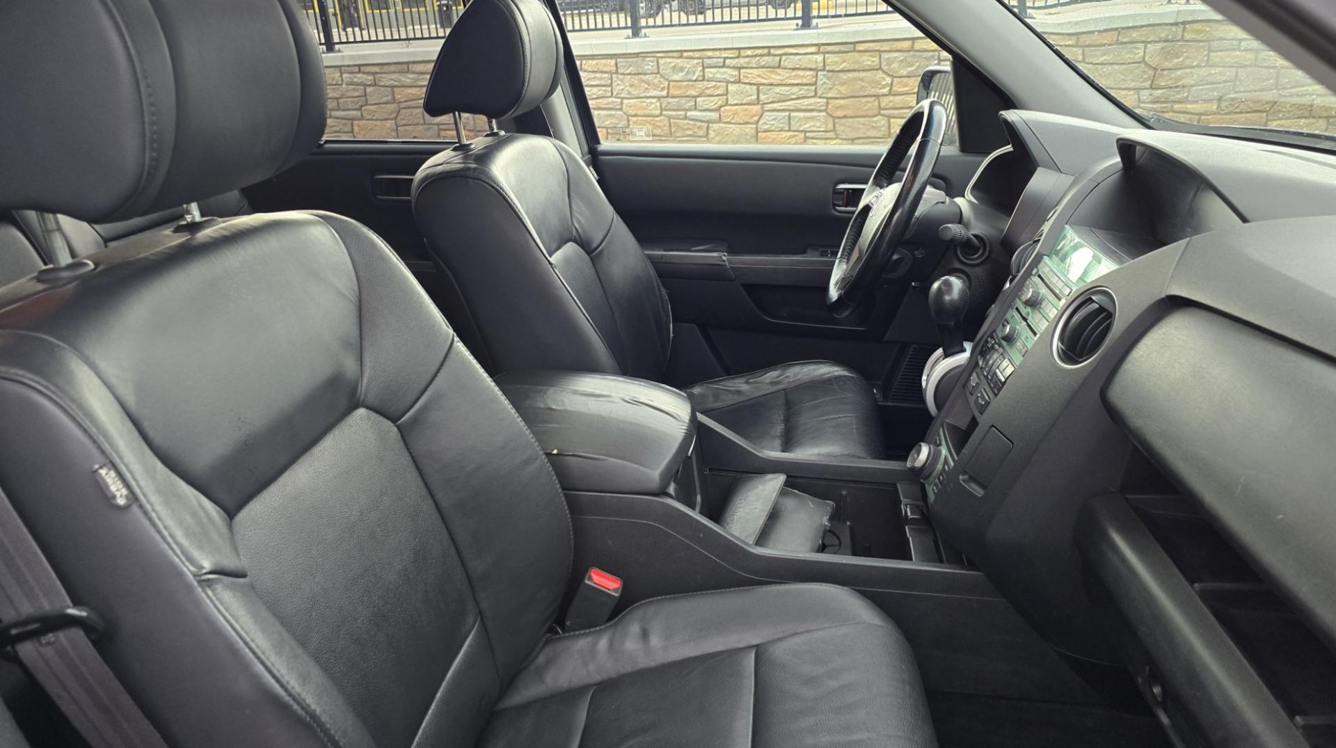 2009 Black /Black Honda Pilot Touring 4WD with RES & Navigation (5FNYF48919B) with an 3.5L V6 SOHC 24V engine, 5-Speed Automatic Overdrive transmission, located at 450 N Russell, Missoula, MT, 59801, (406) 543-6600, 46.874496, -114.017433 - Yes it's a lot of miles but the motor has been well maintained. New Timing Belt only has 18K Miles on it. Runs Amazing. 3.5L V6 has lots of pep. 4WD Works Great., Nice All terrain tires are like new, Heated Power Leather Front Seats. 3rd Row Seating in the back. Power Sun Roof. Power Windows and Loc - Photo#20