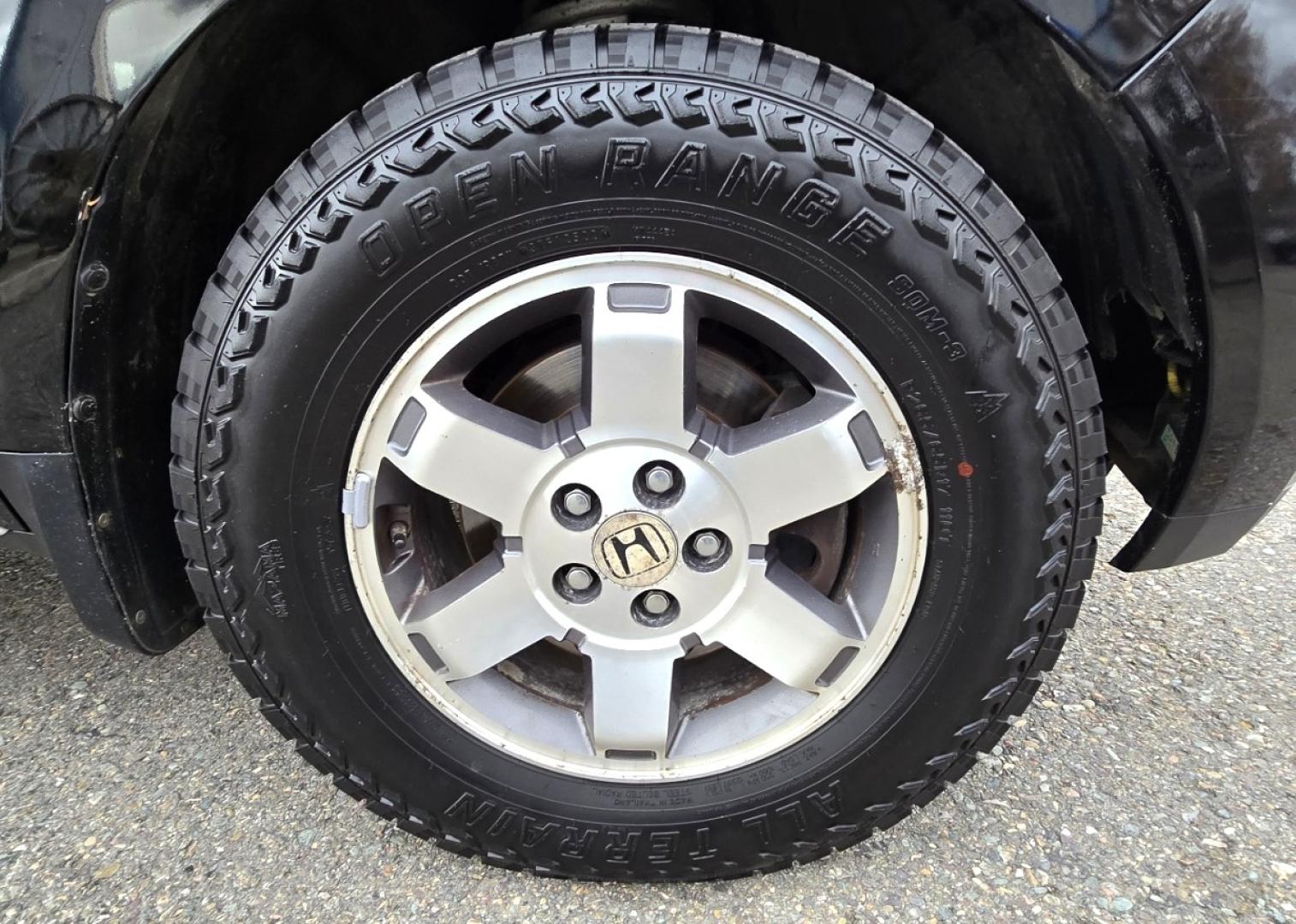 2009 Black /Black Honda Pilot Touring 4WD with RES & Navigation (5FNYF48919B) with an 3.5L V6 SOHC 24V engine, 5-Speed Automatic Overdrive transmission, located at 450 N Russell, Missoula, MT, 59801, (406) 543-6600, 46.874496, -114.017433 - Yes it's a lot of miles but the motor has been well maintained. New Timing Belt only has 18K Miles on it. Runs Amazing. 3.5L V6 has lots of pep. 4WD Works Great., Nice All terrain tires are like new, Heated Power Leather Front Seats. 3rd Row Seating in the back. Power Sun Roof. Power Windows and Loc - Photo#23