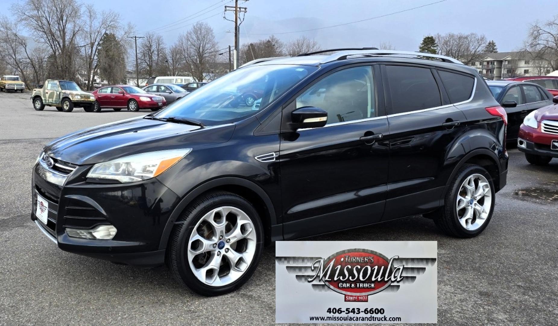 2013 Black /Black Ford Escape Titanium 4WD (1FMCU9J91DU) with an 2.0L L4 DOHC 16V engine, 6-Speed Automatic transmission, located at 450 N Russell, Missoula, MT, 59801, (406) 543-6600, 46.874496, -114.017433 - Cute AWD SUV. 2.0L I4 Engine runs Amazing! Huge Panoramic Sunroof. Navigation. Heated Leather Front Seats. AM FM CD Player with Bluetooth Audio and Phone Connectivity. Backup Camera. Power Lift Gate. Remote Start. Clean Title and Carfax. We Finance through local Credit Unions. We do NOT offer In - Photo#1