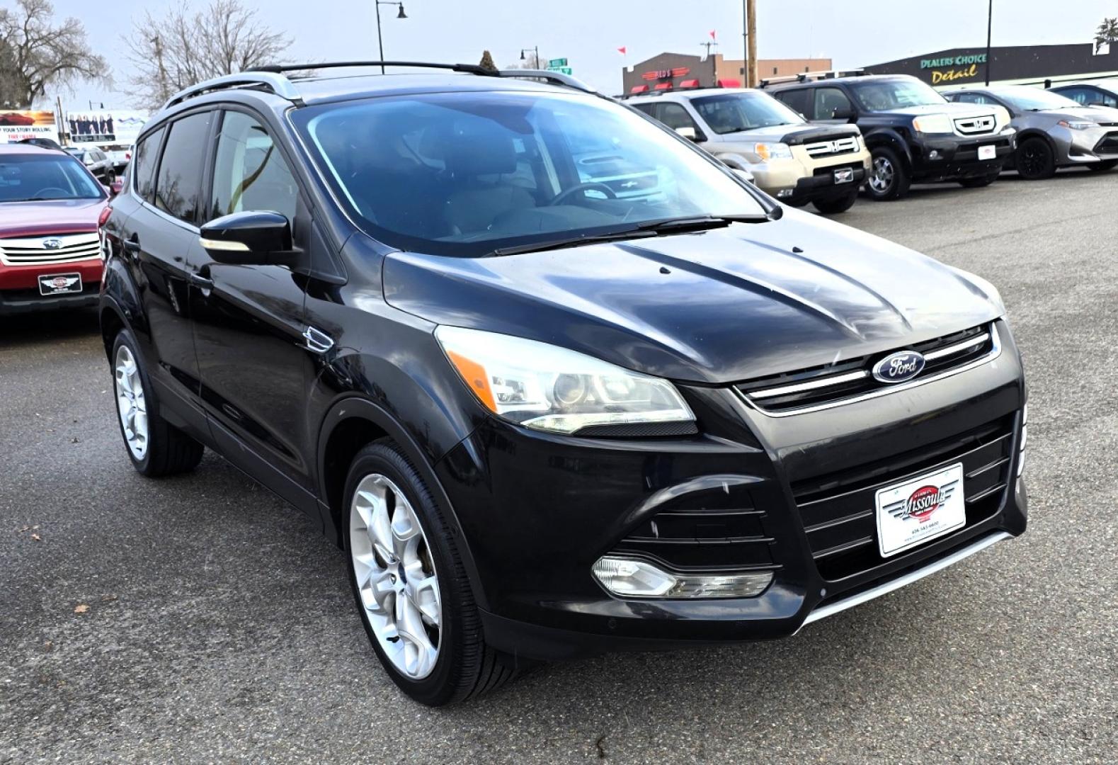2013 Black /Black Ford Escape Titanium 4WD (1FMCU9J91DU) with an 2.0L L4 DOHC 16V engine, 6-Speed Automatic transmission, located at 450 N Russell, Missoula, MT, 59801, (406) 543-6600, 46.874496, -114.017433 - Cute AWD SUV. 2.0L I4 Engine runs Amazing! Huge Panoramic Sunroof. Navigation. Heated Leather Front Seats. AM FM CD Player with Bluetooth Audio and Phone Connectivity. Backup Camera. Power Lift Gate. Remote Start. Clean Title and Carfax. We Finance through local Credit Unions. We do NOT offer In - Photo#3