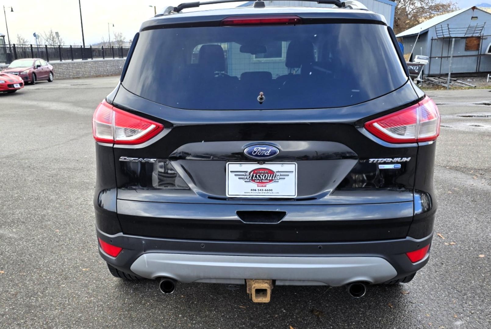2013 Black /Black Ford Escape Titanium 4WD (1FMCU9J91DU) with an 2.0L L4 DOHC 16V engine, 6-Speed Automatic transmission, located at 450 N Russell, Missoula, MT, 59801, (406) 543-6600, 46.874496, -114.017433 - Cute AWD SUV. 2.0L I4 Engine runs Amazing! Huge Panoramic Sunroof. Navigation. Heated Leather Front Seats. AM FM CD Player with Bluetooth Audio and Phone Connectivity. Backup Camera. Power Lift Gate. Remote Start. Clean Title and Carfax. We Finance through local Credit Unions. We do NOT offer In - Photo#8
