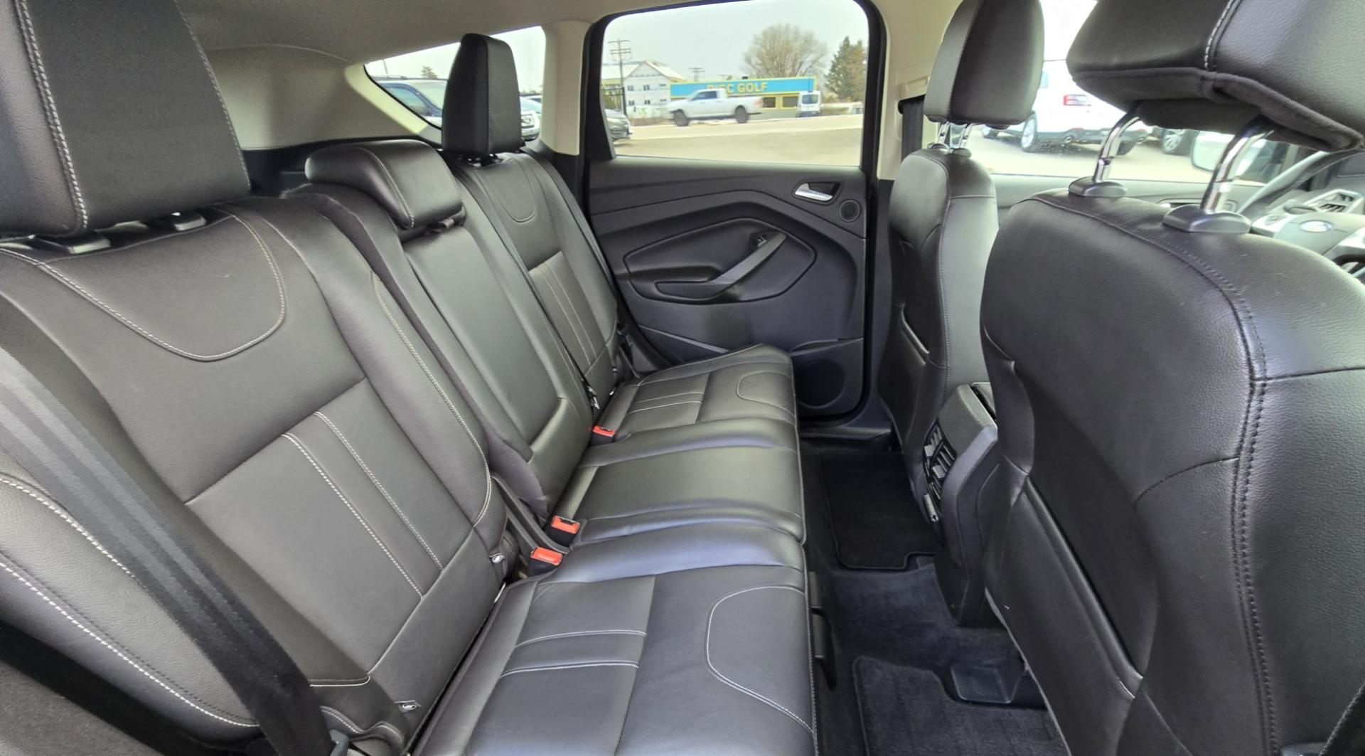 2013 Black /Black Ford Escape Titanium 4WD (1FMCU9J91DU) with an 2.0L L4 DOHC 16V engine, 6-Speed Automatic transmission, located at 450 N Russell, Missoula, MT, 59801, (406) 543-6600, 46.874496, -114.017433 - Cute AWD SUV. 2.0L I4 Engine runs Amazing! Huge Panoramic Sunroof. Navigation. Heated Leather Front Seats. AM FM CD Player with Bluetooth Audio and Phone Connectivity. Backup Camera. Power Lift Gate. Remote Start. Clean Title and Carfax. We Finance through local Credit Unions. We do NOT offer In - Photo#11