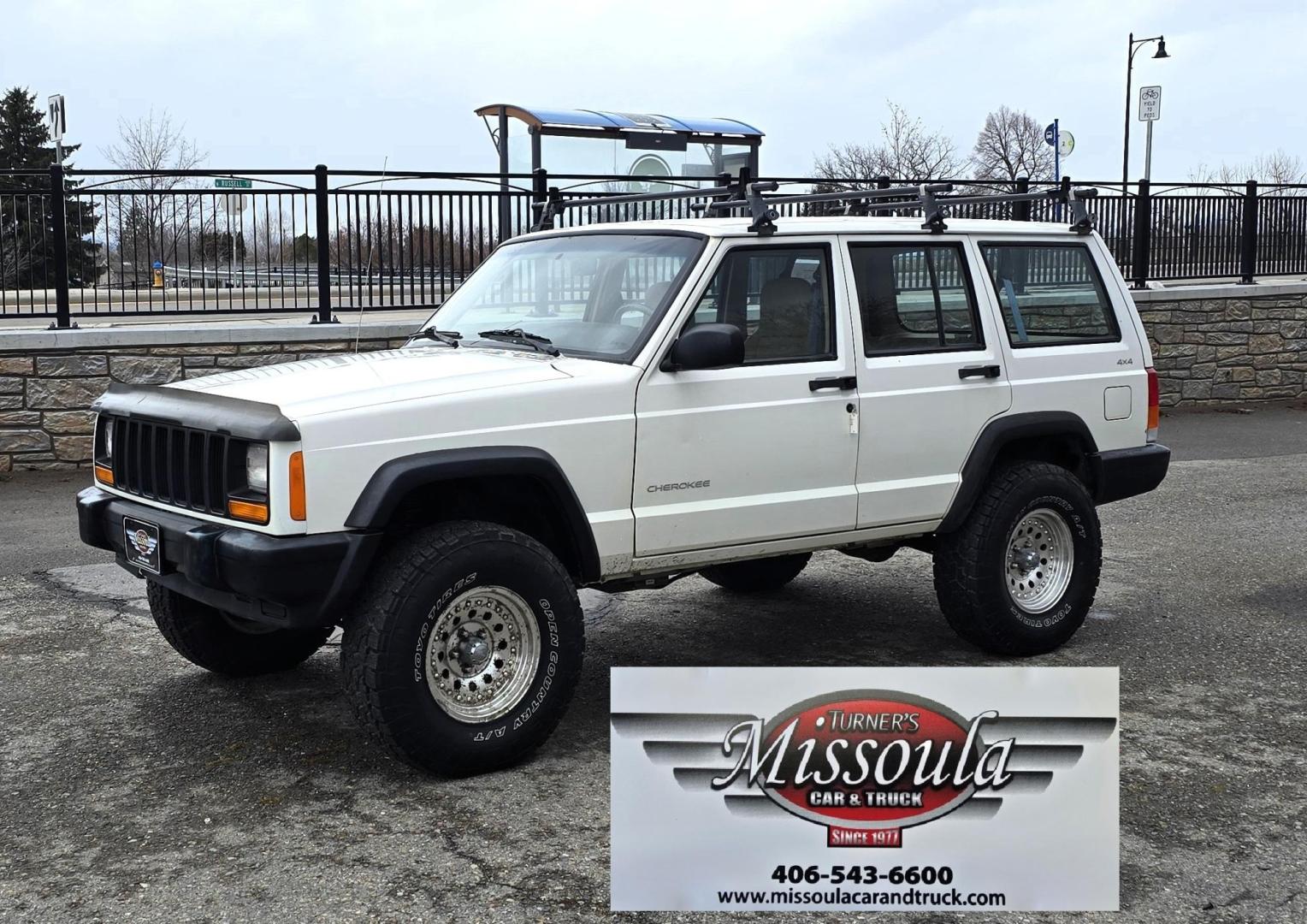 1999 White /Tan Jeep Cherokee SE 4-Door 4WD (1J4FF28S9XL) with an 4.0L L6 OHV 12V engine, Automatic transmission, located at 450 N Russell, Missoula, MT, 59801, (406) 543-6600, 46.874496, -114.017433 - 4WD Jeep Cherokee with the almost bullet proof 4.0L Straight Six Engine. Excellent Miles for the Year. Automatic Transmission. Air. Cruise. Tilt. Roof Rack. Nice Wheels. Does have the clear coat peeling on the passenger side. Because of the age, our lenders do not offer financing on this vehicle. - Photo#1