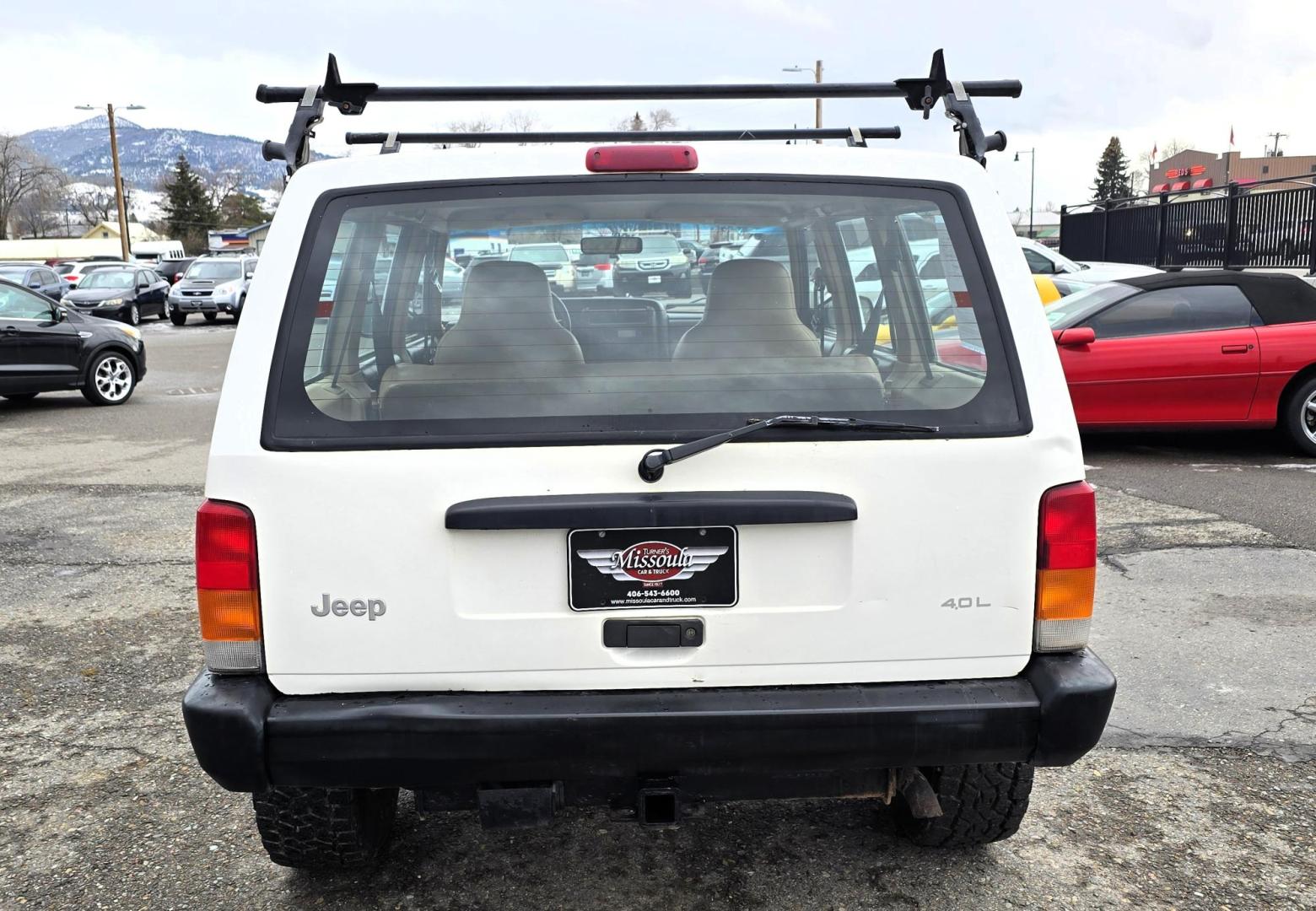 1999 White /Tan Jeep Cherokee SE 4-Door 4WD (1J4FF28S9XL) with an 4.0L L6 OHV 12V engine, Automatic transmission, located at 450 N Russell, Missoula, MT, 59801, (406) 543-6600, 46.874496, -114.017433 - 4WD Jeep Cherokee with the almost bullet proof 4.0L Straight Six Engine. Excellent Miles for the Year. Automatic Transmission. Air. Cruise. Tilt. Roof Rack. Nice Wheels. Does have the clear coat peeling on the passenger side. Because of the age, our lenders do not offer financing on this vehicle. - Photo#4