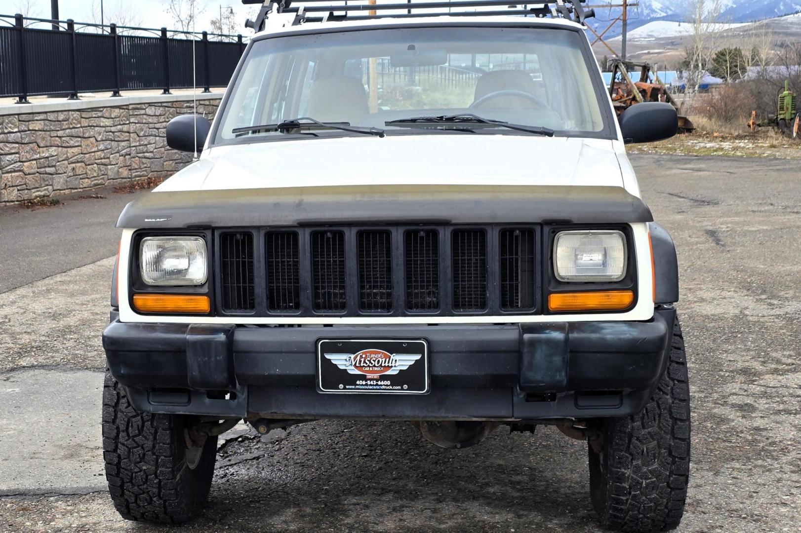 1999 White /Tan Jeep Cherokee SE 4-Door 4WD (1J4FF28S9XL) with an 4.0L L6 OHV 12V engine, Automatic transmission, located at 450 N Russell, Missoula, MT, 59801, (406) 543-6600, 46.874496, -114.017433 - 4WD Jeep Cherokee with the almost bullet proof 4.0L Straight Six Engine. Excellent Miles for the Year. Automatic Transmission. Air. Cruise. Tilt. Roof Rack. Nice Wheels. Does have the clear coat peeling on the passenger side. Because of the age, our lenders do not offer financing on this vehicle. - Photo#8