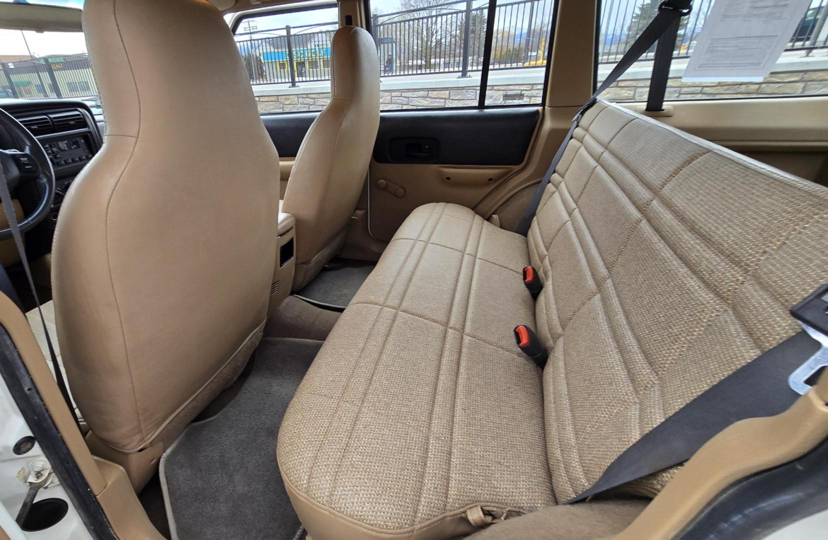 1999 White /Tan Jeep Cherokee SE 4-Door 4WD (1J4FF28S9XL) with an 4.0L L6 OHV 12V engine, Automatic transmission, located at 450 N Russell, Missoula, MT, 59801, (406) 543-6600, 46.874496, -114.017433 - 4WD Jeep Cherokee with the almost bullet proof 4.0L Straight Six Engine. Excellent Miles for the Year. Automatic Transmission. Air. Cruise. Tilt. Roof Rack. Nice Wheels. Does have the clear coat peeling on the passenger side. Because of the age, our lenders do not offer financing on this vehicle. - Photo#10