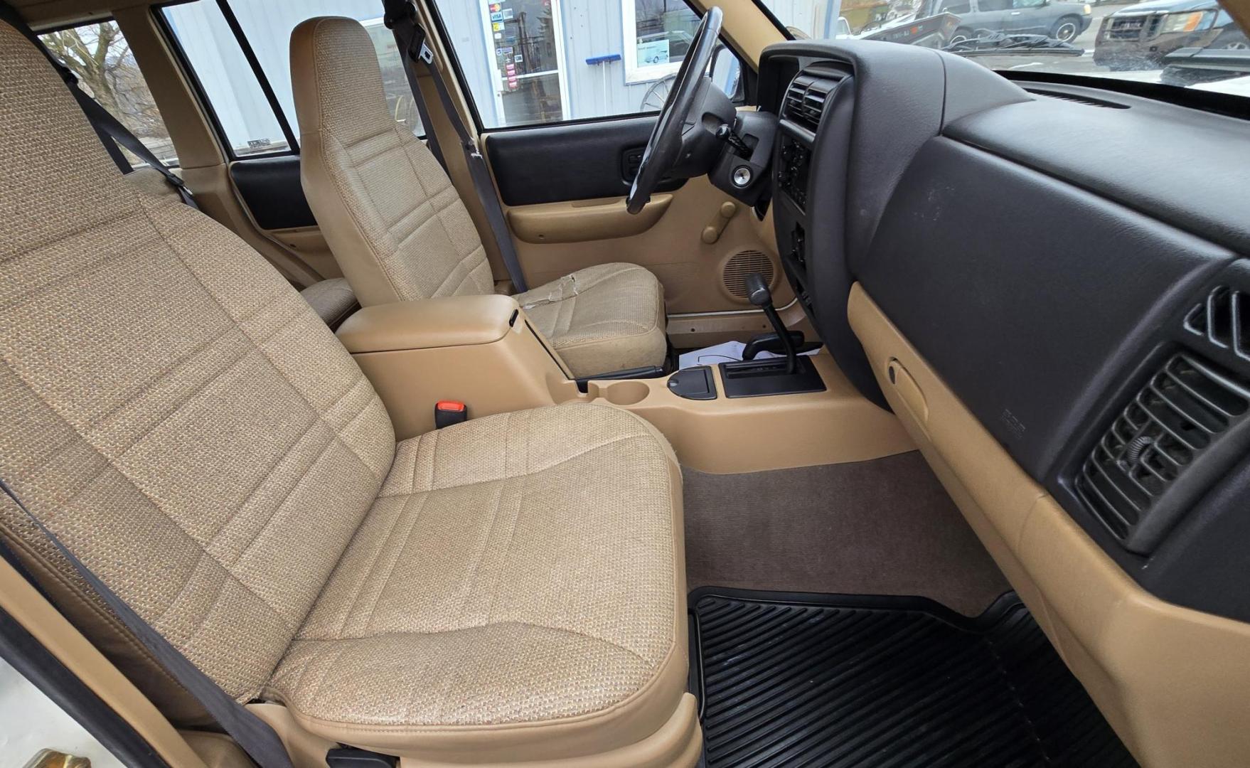 1999 White /Tan Jeep Cherokee SE 4-Door 4WD (1J4FF28S9XL) with an 4.0L L6 OHV 12V engine, Automatic transmission, located at 450 N Russell, Missoula, MT, 59801, (406) 543-6600, 46.874496, -114.017433 - 4WD Jeep Cherokee with the almost bullet proof 4.0L Straight Six Engine. Excellent Miles for the Year. Automatic Transmission. Air. Cruise. Tilt. Roof Rack. Nice Wheels. Does have the clear coat peeling on the passenger side. Because of the age, our lenders do not offer financing on this vehicle. - Photo#11