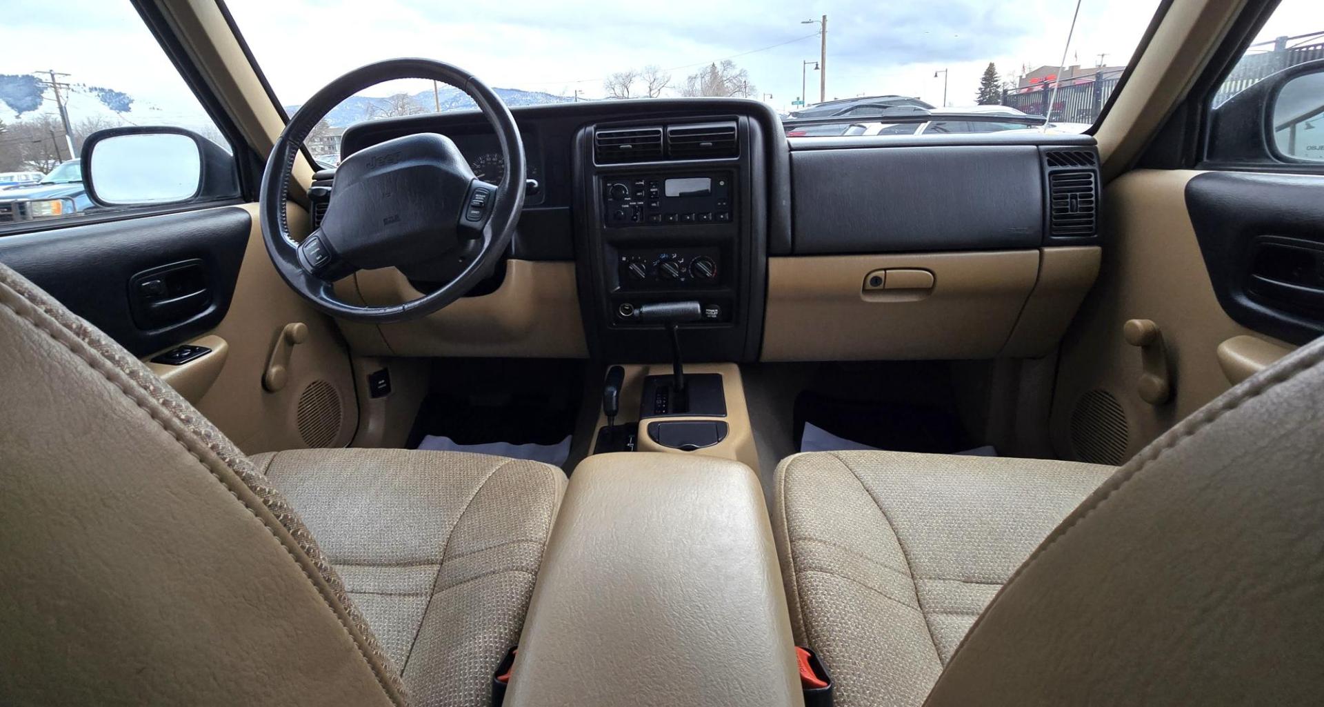 1999 White /Tan Jeep Cherokee SE 4-Door 4WD (1J4FF28S9XL) with an 4.0L L6 OHV 12V engine, Automatic transmission, located at 450 N Russell, Missoula, MT, 59801, (406) 543-6600, 46.874496, -114.017433 - 4WD Jeep Cherokee with the almost bullet proof 4.0L Straight Six Engine. Excellent Miles for the Year. Automatic Transmission. Air. Cruise. Tilt. Roof Rack. Nice Wheels. Does have the clear coat peeling on the passenger side. Because of the age, our lenders do not offer financing on this vehicle. - Photo#13