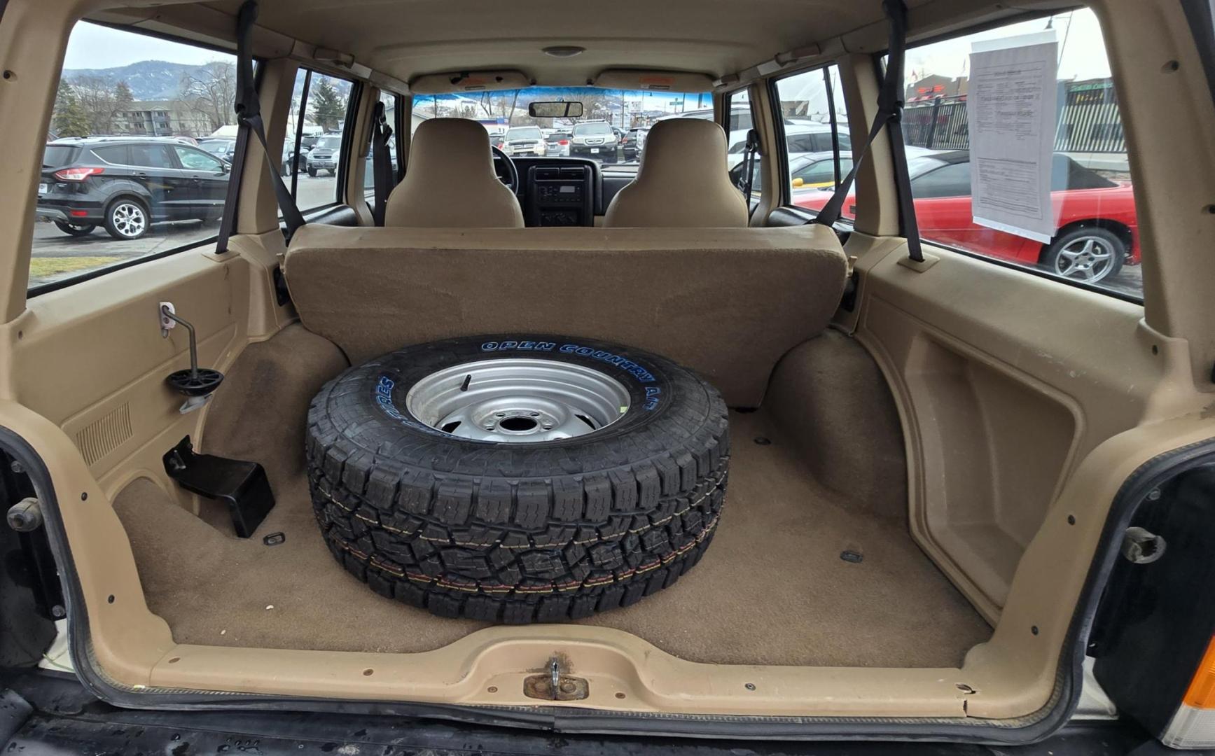 1999 White /Tan Jeep Cherokee SE 4-Door 4WD (1J4FF28S9XL) with an 4.0L L6 OHV 12V engine, Automatic transmission, located at 450 N Russell, Missoula, MT, 59801, (406) 543-6600, 46.874496, -114.017433 - 4WD Jeep Cherokee with the almost bullet proof 4.0L Straight Six Engine. Excellent Miles for the Year. Automatic Transmission. Air. Cruise. Tilt. Roof Rack. Nice Wheels. Does have the clear coat peeling on the passenger side. Because of the age, our lenders do not offer financing on this vehicle. - Photo#14