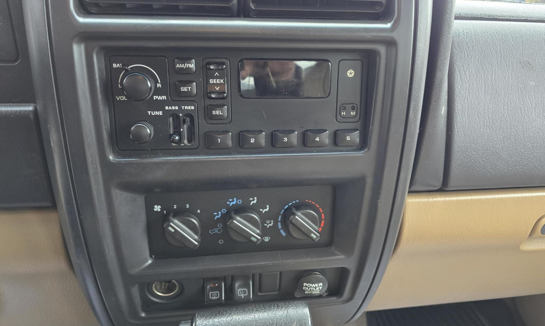 1999 White /Tan Jeep Cherokee SE 4-Door 4WD (1J4FF28S9XL) with an 4.0L L6 OHV 12V engine, Automatic transmission, located at 450 N Russell, Missoula, MT, 59801, (406) 543-6600, 46.874496, -114.017433 - 4WD Jeep Cherokee with the almost bullet proof 4.0L Straight Six Engine. Excellent Miles for the Year. Automatic Transmission. Air. Cruise. Tilt. Roof Rack. Nice Wheels. Does have the clear coat peeling on the passenger side. Because of the age, our lenders do not offer financing on this vehicle. - Photo#16