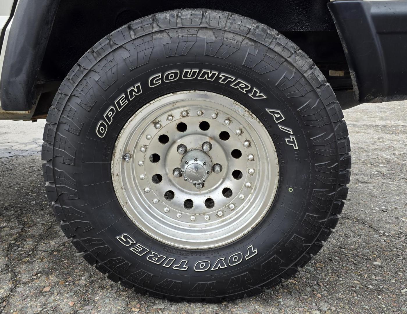 1999 White /Tan Jeep Cherokee SE 4-Door 4WD (1J4FF28S9XL) with an 4.0L L6 OHV 12V engine, Automatic transmission, located at 450 N Russell, Missoula, MT, 59801, (406) 543-6600, 46.874496, -114.017433 - 4WD Jeep Cherokee with the almost bullet proof 4.0L Straight Six Engine. Excellent Miles for the Year. Automatic Transmission. Air. Cruise. Tilt. Roof Rack. Nice Wheels. Does have the clear coat peeling on the passenger side. Because of the age, our lenders do not offer financing on this vehicle. - Photo#15