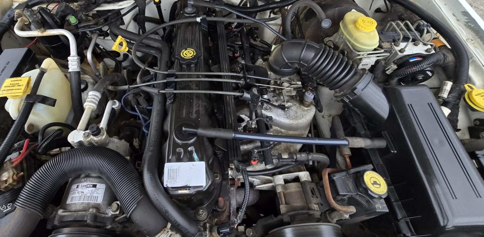 1999 White /Tan Jeep Cherokee SE 4-Door 4WD (1J4FF28S9XL) with an 4.0L L6 OHV 12V engine, Automatic transmission, located at 450 N Russell, Missoula, MT, 59801, (406) 543-6600, 46.874496, -114.017433 - 4WD Jeep Cherokee with the almost bullet proof 4.0L Straight Six Engine. Excellent Miles for the Year. Automatic Transmission. Air. Cruise. Tilt. Roof Rack. Nice Wheels. Does have the clear coat peeling on the passenger side. Because of the age, our lenders do not offer financing on this vehicle. - Photo#20