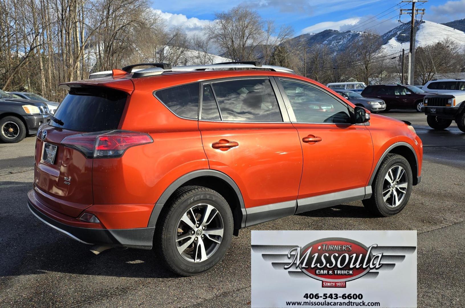 2016 Orange /Black Toyota RAV4 XLE AWD (2T3RFREV1GW) with an 2.5L L4 DOHC 16V engine, 6A transmission, located at 450 N Russell, Missoula, MT, 59801, (406) 543-6600, 46.874496, -114.017433 - Photo#1