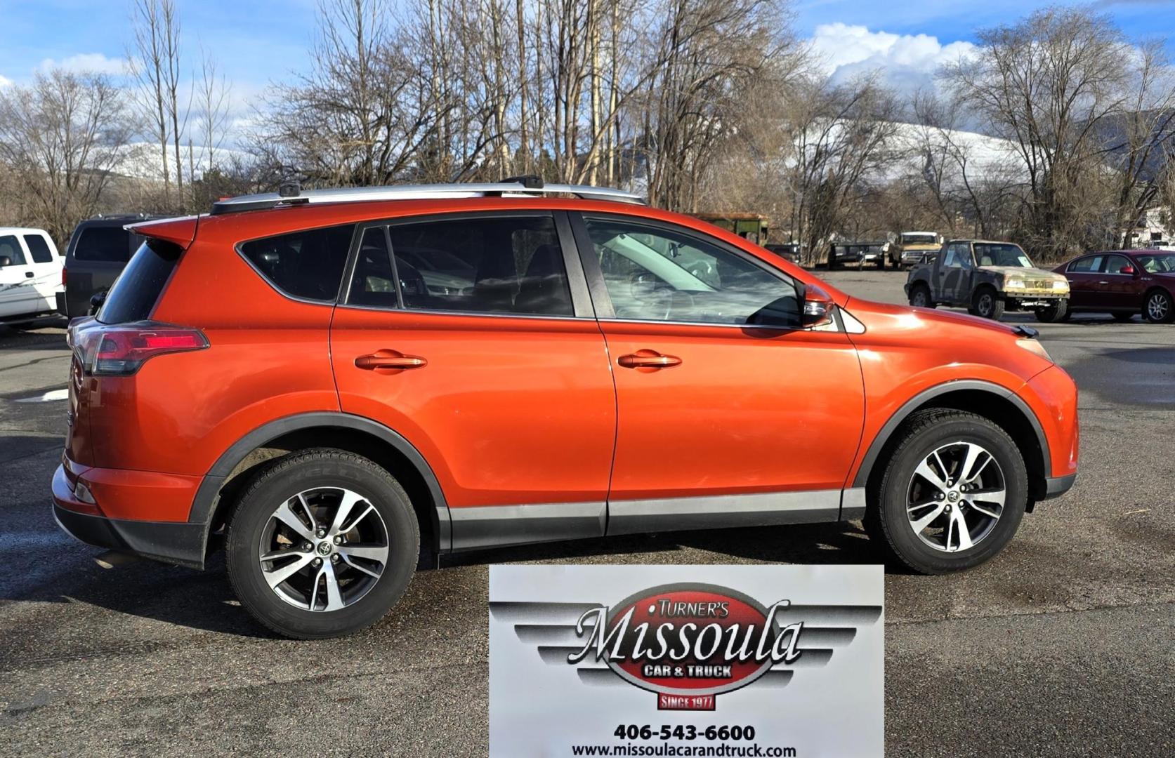 2016 Orange /Black Toyota RAV4 XLE AWD (2T3RFREV1GW) with an 2.5L L4 DOHC 16V engine, 6A transmission, located at 450 N Russell, Missoula, MT, 59801, (406) 543-6600, 46.874496, -114.017433 - Photo#0