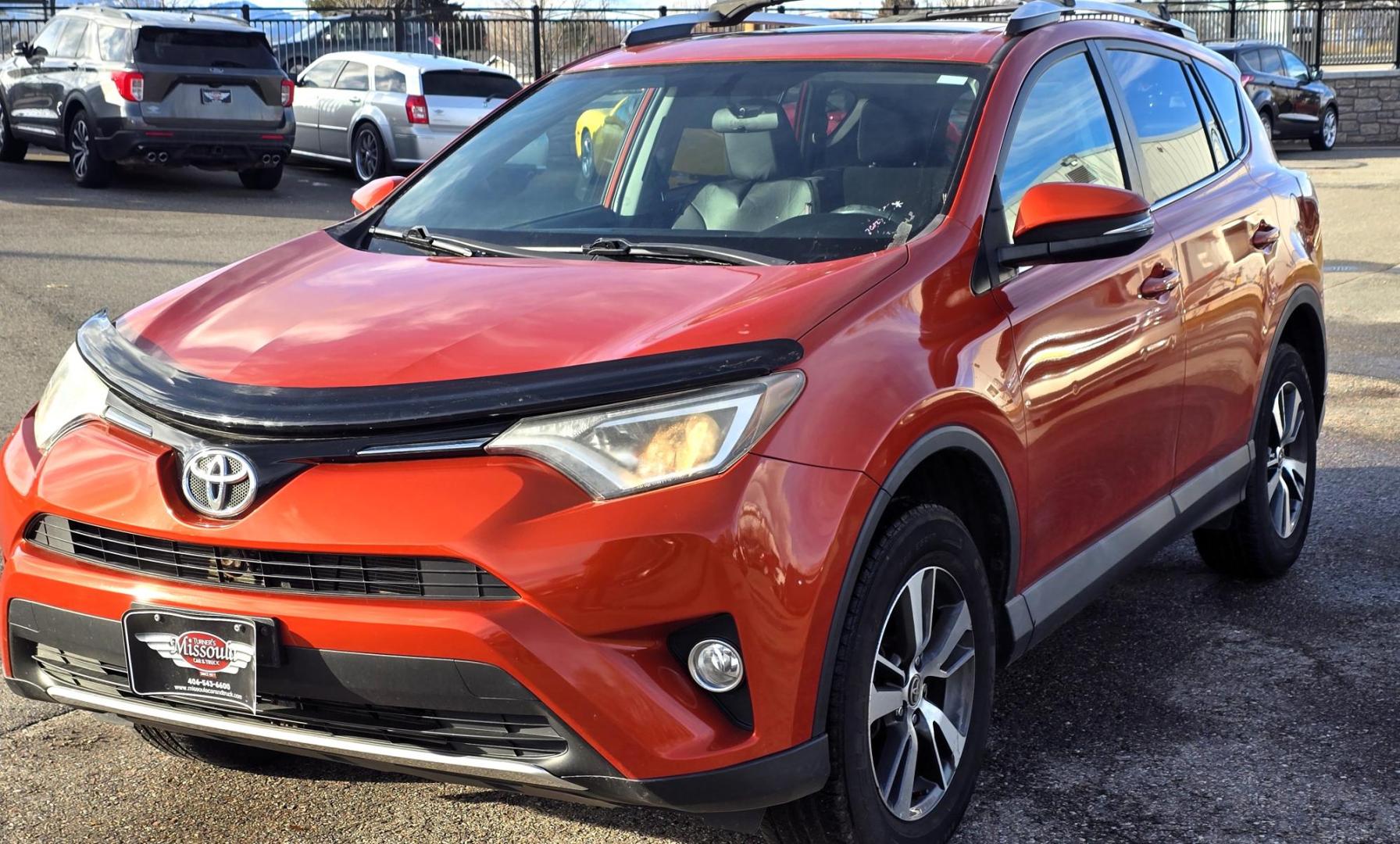 2016 Orange /Black Toyota RAV4 XLE AWD (2T3RFREV1GW) with an 2.5L L4 DOHC 16V engine, 6A transmission, located at 450 N Russell, Missoula, MT, 59801, (406) 543-6600, 46.874496, -114.017433 - Photo#4