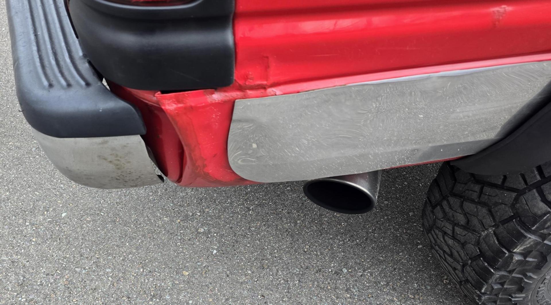 1998 Red /Blue Dodge Ram 2500 Quad Cab 6.5-ft. Bed 4WD (1B7KF2364WJ) with an 5.9L L6 OHV 24V TURBO DIESEL engine, 5 Speed Manual transmission, located at 450 N Russell, Missoula, MT, 59801, (406) 543-6600, 46.874496, -114.017433 - Highly Desirable 2nd Generation Dodge 3/4 Ton 4WD with a 24 Valve 5.9L Cummins Diesel Engine. Comes with a Rare 5 Speed Manual Transmission. Runs and Shits well. Air Conditioning. Nice Wheels and Tires. Box has a few dings and dents. Set up for a gooseneck ball. Because of the age, our lenders d - Photo#8