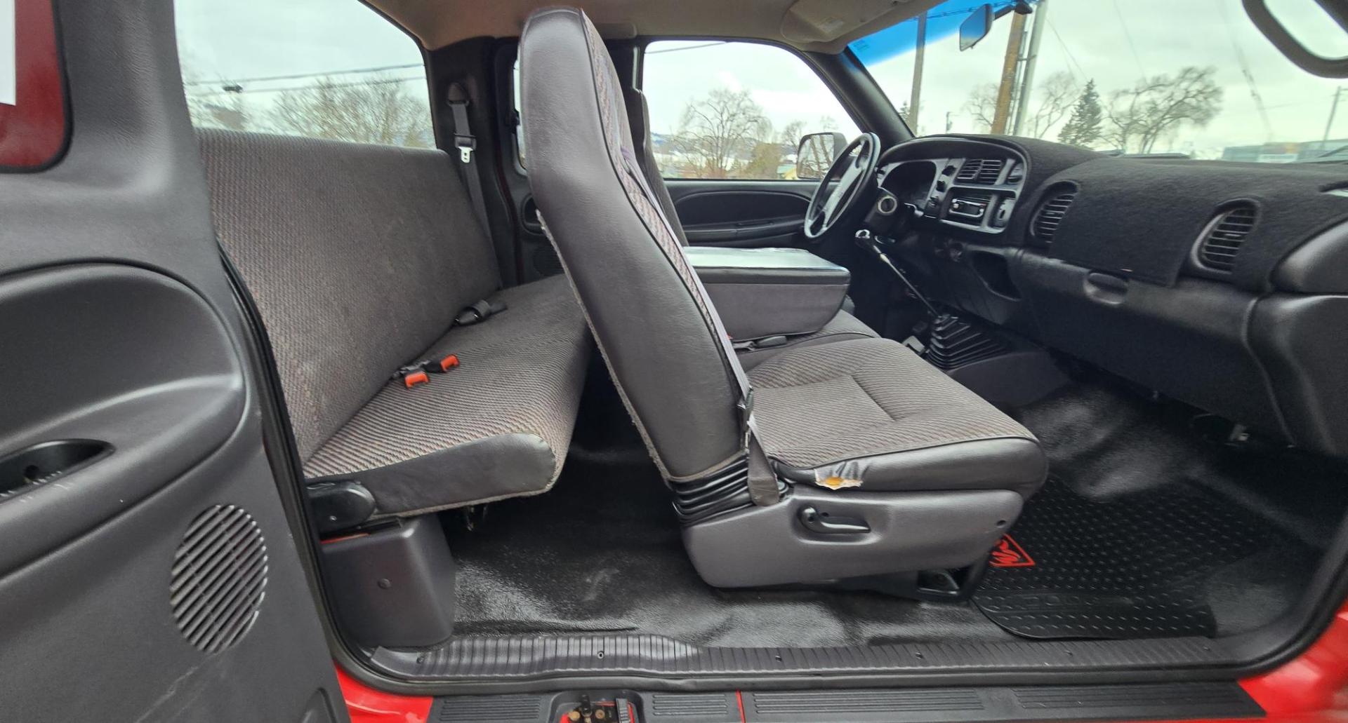 1998 Red /Blue Dodge Ram 2500 Quad Cab 6.5-ft. Bed 4WD (1B7KF2364WJ) with an 5.9L L6 OHV 24V TURBO DIESEL engine, 5 Speed Manual transmission, located at 450 N Russell, Missoula, MT, 59801, (406) 543-6600, 46.874496, -114.017433 - Highly Desirable 2nd Generation Dodge 3/4 Ton 4WD with a 24 Valve 5.9L Cummins Diesel Engine. Comes with a Rare 5 Speed Manual Transmission. Runs and Shits well. Air Conditioning. Nice Wheels and Tires. Box has a few dings and dents. Set up for a gooseneck ball. Because of the age, our lenders d - Photo#13