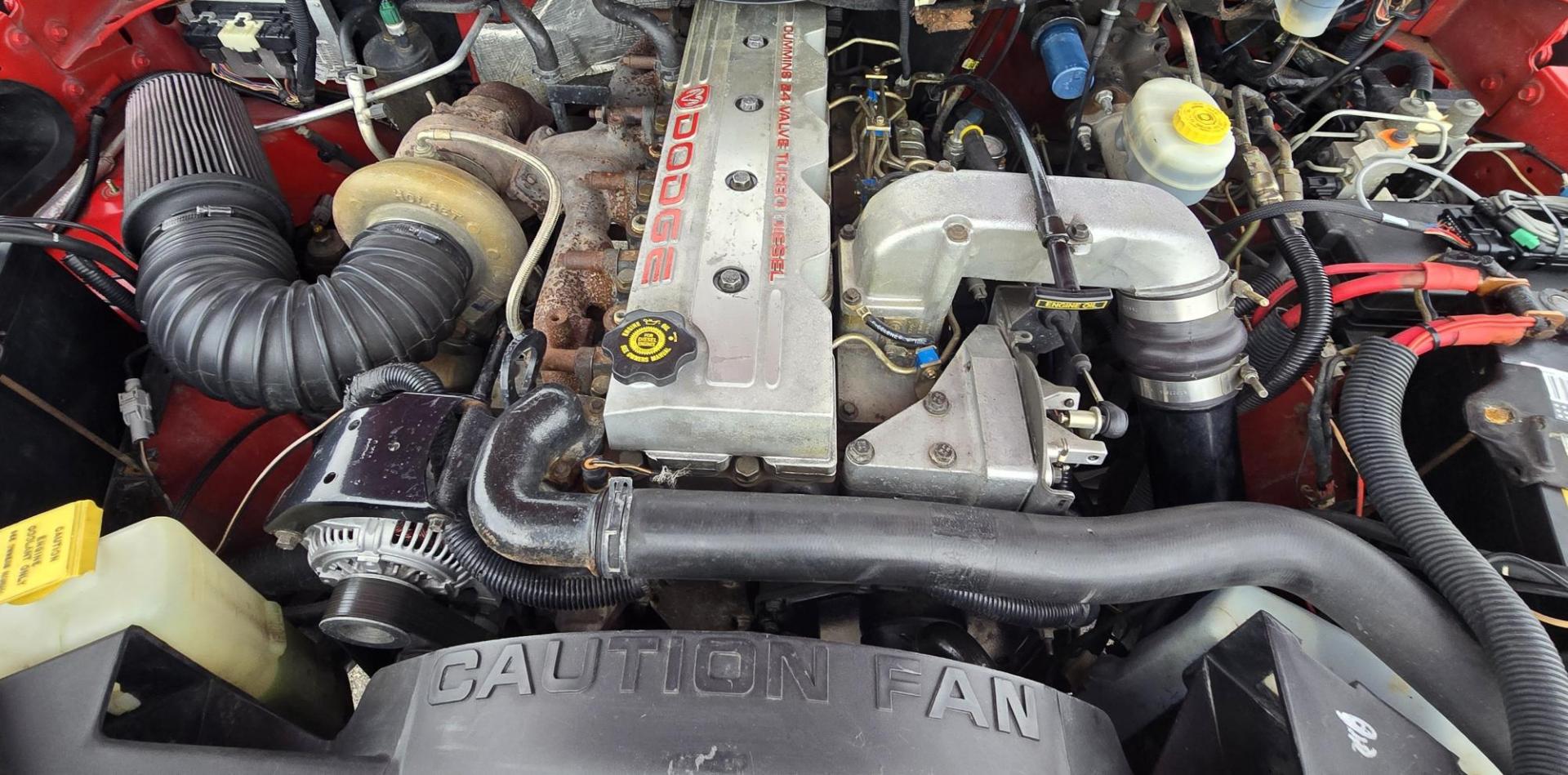 1998 Red /Blue Dodge Ram 2500 Quad Cab 6.5-ft. Bed 4WD (1B7KF2364WJ) with an 5.9L L6 OHV 24V TURBO DIESEL engine, 5 Speed Manual transmission, located at 450 N Russell, Missoula, MT, 59801, (406) 543-6600, 46.874496, -114.017433 - Highly Desirable 2nd Generation Dodge 3/4 Ton 4WD with a 24 Valve 5.9L Cummins Diesel Engine. Comes with a Rare 5 Speed Manual Transmission. Runs and Shits well. Air Conditioning. Nice Wheels and Tires. Box has a few dings and dents. Set up for a gooseneck ball. Because of the age, our lenders d - Photo#17