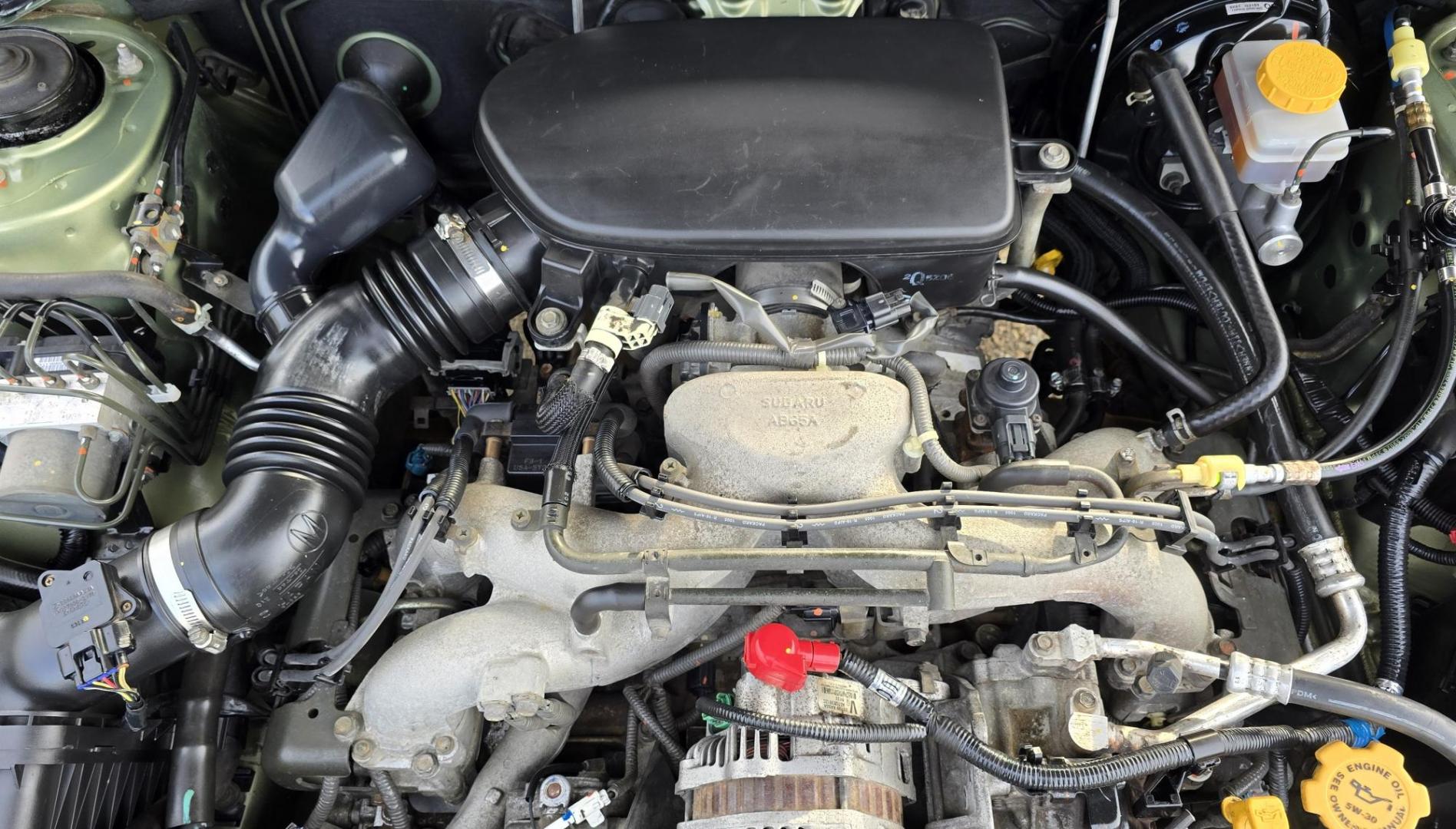 2006 Green /Tan Subaru Outback 2.5i Wagon (4S4BP61C667) with an 2.5L H4 SOHC 16V engine, 4-Speed Automatic Overdrive transmission, located at 450 N Russell, Missoula, MT, 59801, (406) 543-6600, 46.874496, -114.017433 - Sharp little AWD Suby. 2.5L H4 Engine. Automatic Transmission. All the maintenance that a Subaru needs. New Timing Belt. New Water Pump. New Head Gasket. Very Quiet. Firestone Tires in great condition. Heated front Seats. Air. Cruise. Tilt. Power Windows and Locks. Very Clean. Has a couple small den - Photo#16