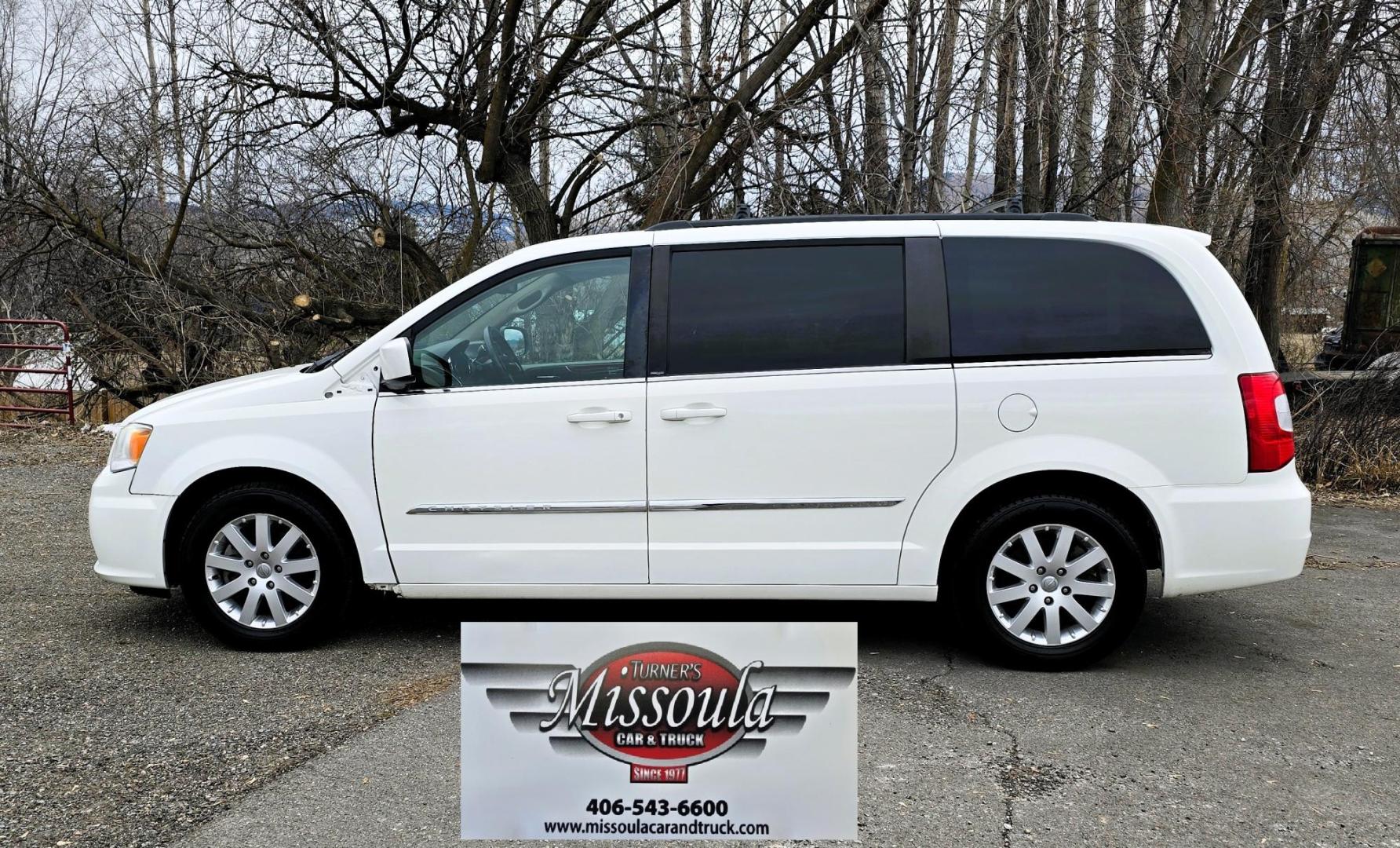 2013 White /Tan Chrysler Town & Country Touring (2C4RC1BG8DR) with an 3.6L V6 DOHC 24V engine, 6-Speed Automatic transmission, located at 450 N Russell, Missoula, MT, 59801, (406) 543-6600, 46.874496, -114.017433 - Excellent Condition Town and Country. 3.6L V6 Engine. Automatic Transmission. 3rd Row Seating. DVD Player. Air. Cruise. Tilt. Rear Climate Control. Power Windows. Power Locks. Power Remote Rear Doors. AM FM XM Bluetooth. Good Tires. 2 Owner with a Clean Title and Carfax. Front Wheel Drive. We Fin - Photo#1
