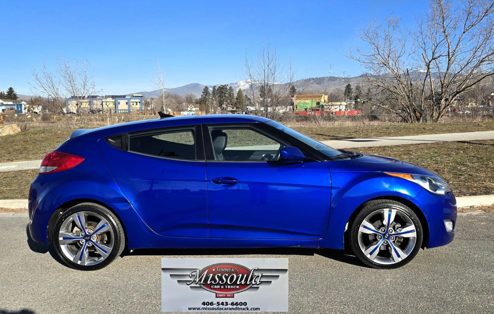 2013 Blue /Black Hyundai Veloster Base (KMHTC6AD8DU) with an 1.6L L4 DOHC 16V engine, Automatic transmission, located at 450 N Russell, Missoula, MT, 59801, (406) 543-6600, 46.874496, -114.017433 - Cute Little 3 Door FWD Coupe. 1.6L I4 Engine. Automatic Transmission. Navigation. Power Sunroof. Air. Cruise. Tilt. Power Windows and Locks. Bluetooth. Comes with an extra set of wheels with studded snow tires mounted. We Finance through local Credit Unions. We do NOT offer In House (Buy Here Pay - Photo#5