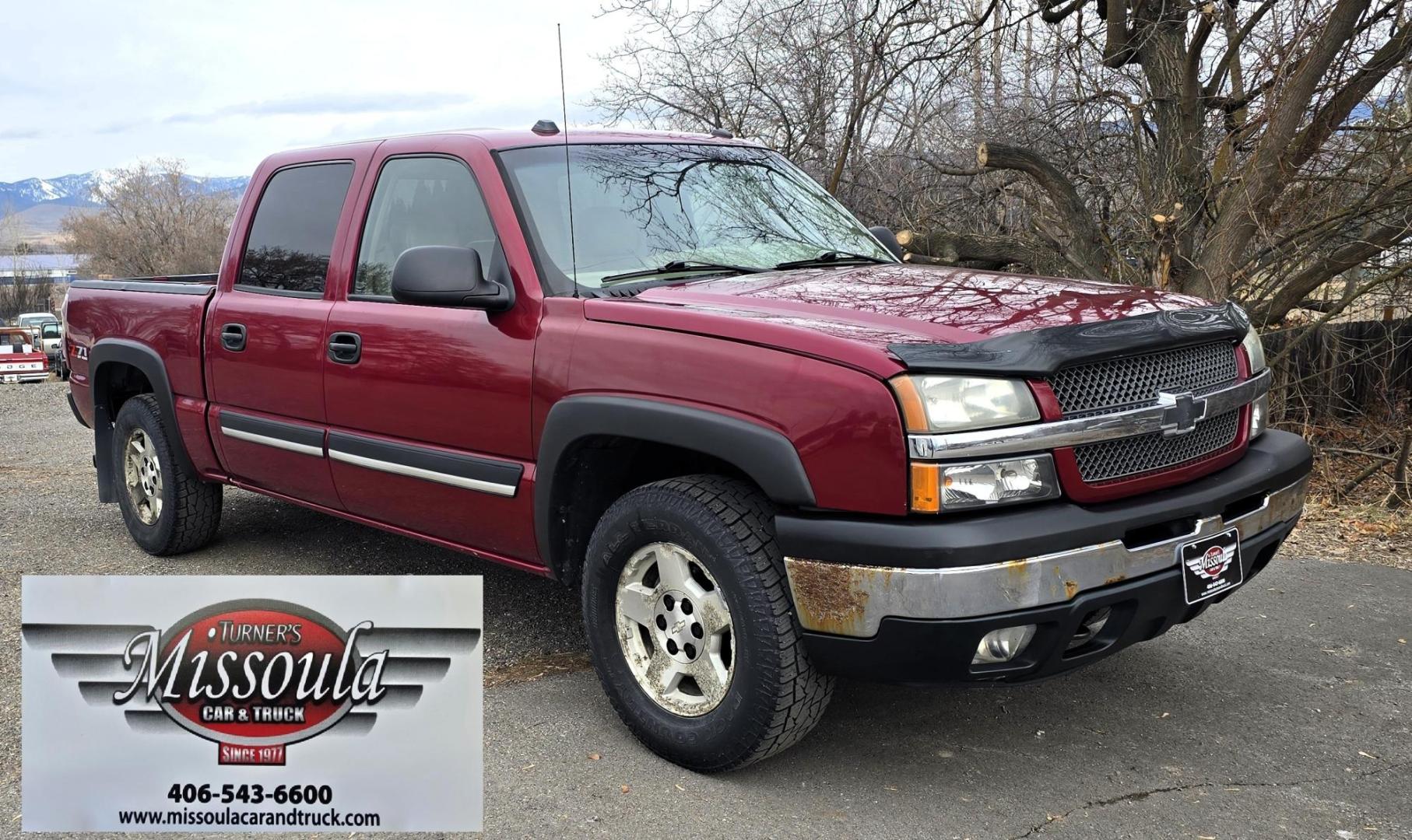 2004 Maroon /Tan Chevrolet Silverado 1500 LS Crew Cab 4WD (2GCEK13T741) with an 5.3L V8 OHV 16V engine, 4-Speed Automatic Overdrive transmission, located at 450 N Russell, Missoula, MT, 59801, (406) 543-6600, 46.874496, -114.017433 - Strong Running 4WD Chevy. 5.3L V8 Engine. Automatic Transmission. Heated Leather Power Front Seats. Rear DVD Player. Power Windows and Locks. AM FM CD Player.Running Boards. Has a check engine light saying there is a misfire but the truck runs great. Does have a Branded Title because the State of Mo - Photo#4