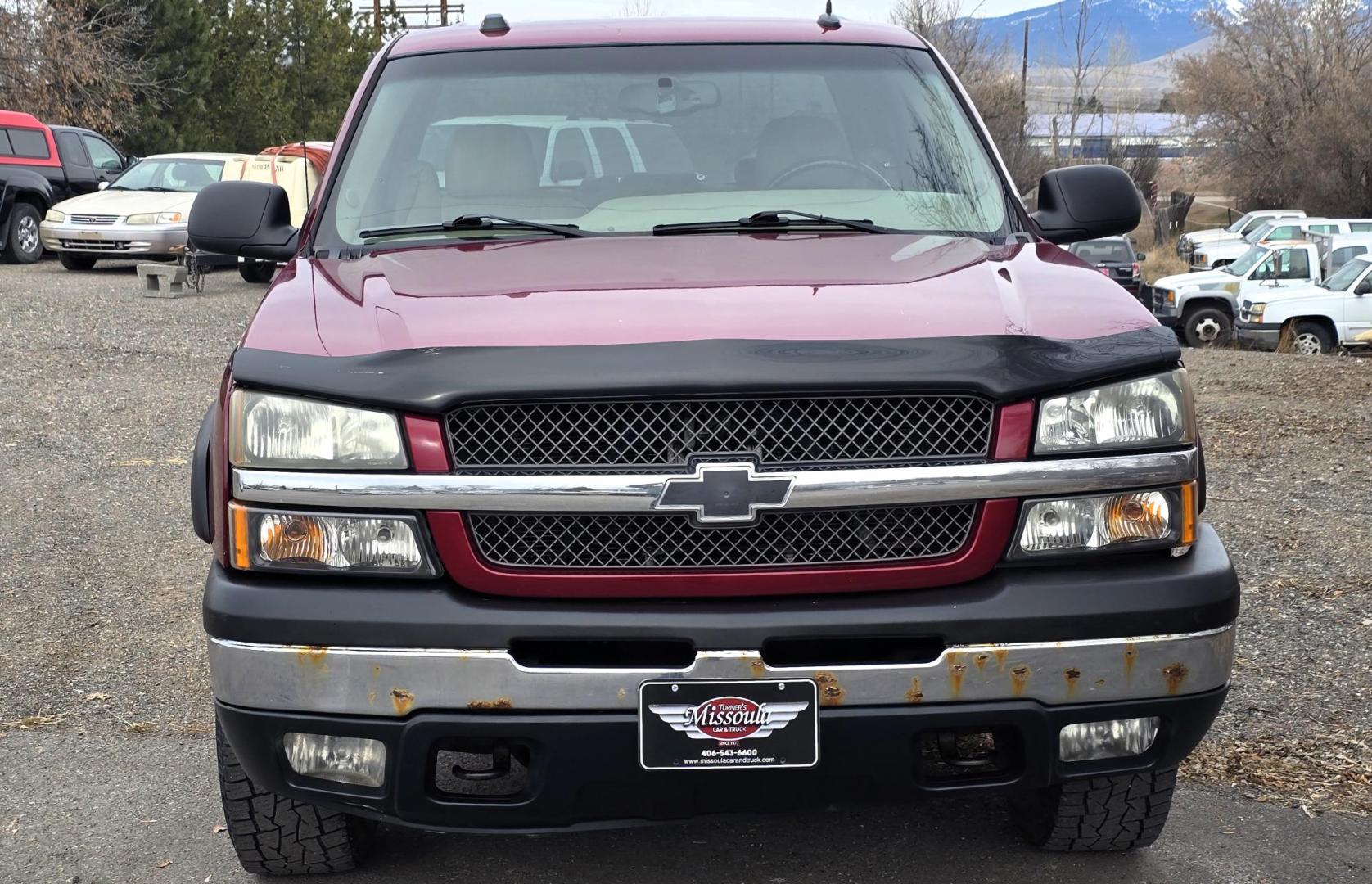 2004 Maroon /Tan Chevrolet Silverado 1500 LS Crew Cab 4WD (2GCEK13T741) with an 5.3L V8 OHV 16V engine, 4-Speed Automatic Overdrive transmission, located at 450 N Russell, Missoula, MT, 59801, (406) 543-6600, 46.874496, -114.017433 - Strong Running 4WD Chevy. 5.3L V8 Engine. Automatic Transmission. Heated Leather Power Front Seats. Rear DVD Player. Power Windows and Locks. AM FM CD Player.Running Boards. Has a check engine light saying there is a misfire but the truck runs great. Does have a Branded Title because the State of Mo - Photo#5