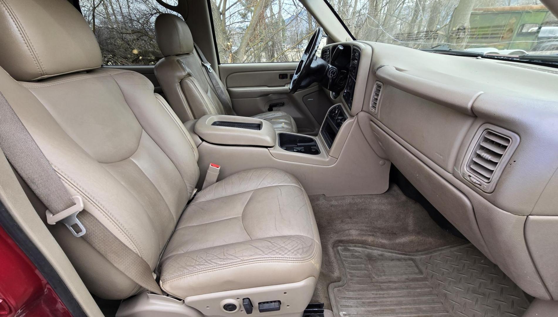 2004 Maroon /Tan Chevrolet Silverado 1500 LS Crew Cab 4WD (2GCEK13T741) with an 5.3L V8 OHV 16V engine, 4-Speed Automatic Overdrive transmission, located at 450 N Russell, Missoula, MT, 59801, (406) 543-6600, 46.874496, -114.017433 - Strong Running 4WD Chevy. 5.3L V8 Engine. Automatic Transmission. Heated Leather Power Front Seats. Rear DVD Player. Power Windows and Locks. AM FM CD Player.Running Boards. Has a check engine light saying there is a misfire but the truck runs great. Does have a Branded Title because the State of Mo - Photo#7