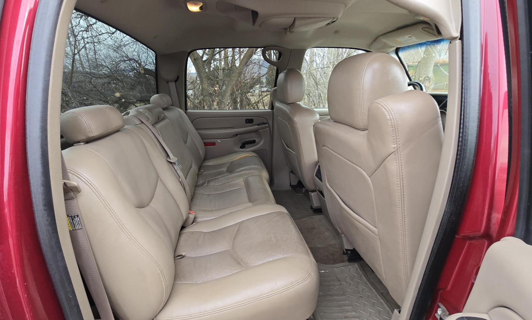 2004 Maroon /Tan Chevrolet Silverado 1500 LS Crew Cab 4WD (2GCEK13T741) with an 5.3L V8 OHV 16V engine, 4-Speed Automatic Overdrive transmission, located at 450 N Russell, Missoula, MT, 59801, (406) 543-6600, 46.874496, -114.017433 - Strong Running 4WD Chevy. 5.3L V8 Engine. Automatic Transmission. Heated Leather Power Front Seats. Rear DVD Player. Power Windows and Locks. AM FM CD Player.Running Boards. Has a check engine light saying there is a misfire but the truck runs great. Does have a Branded Title because the State of Mo - Photo#8